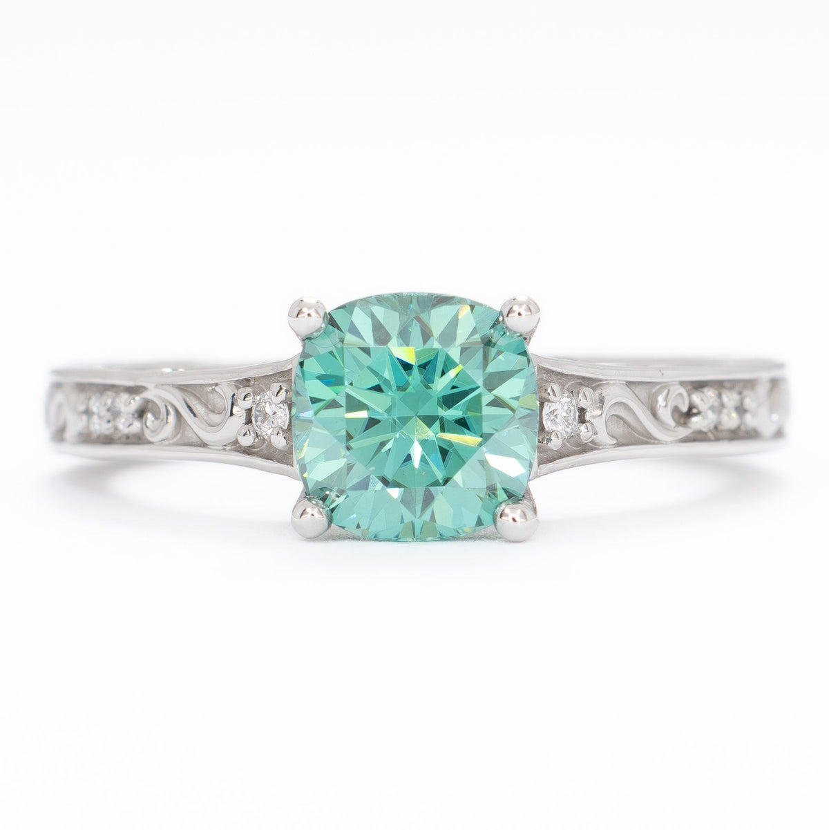 clementine ring in white gold with green moissanite cushion