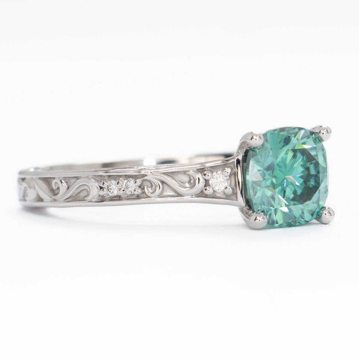 clementine ring in white gold with green moissanite cushion