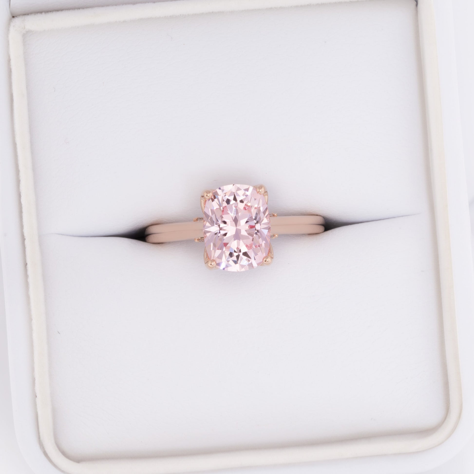 clover floral inspired engagement ring with peach lab sapphire