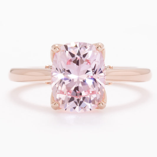 clover floral inspired engagement ring with peach lab sapphire