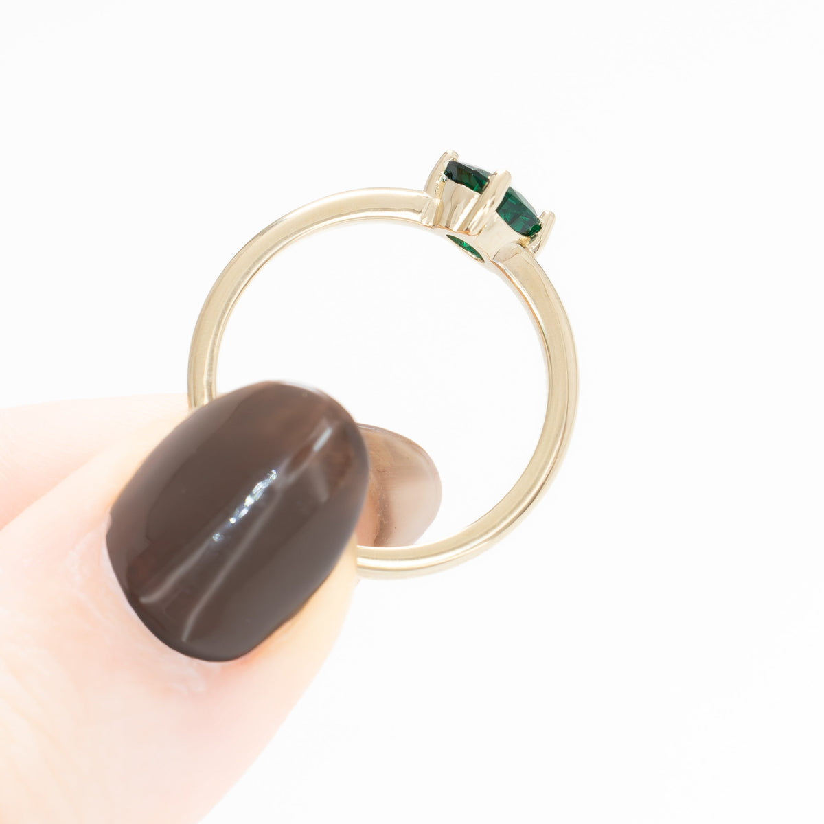 compass set solitaire ring in yellow gold with oval lab emerald