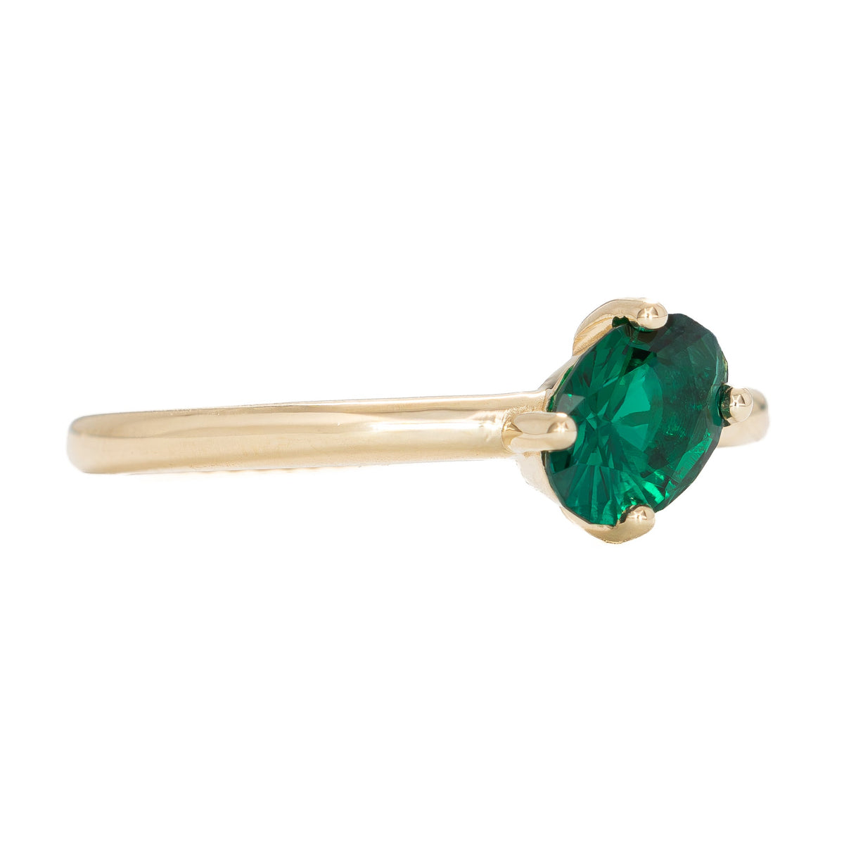 compass set solitaire ring in yellow gold with oval lab emerald