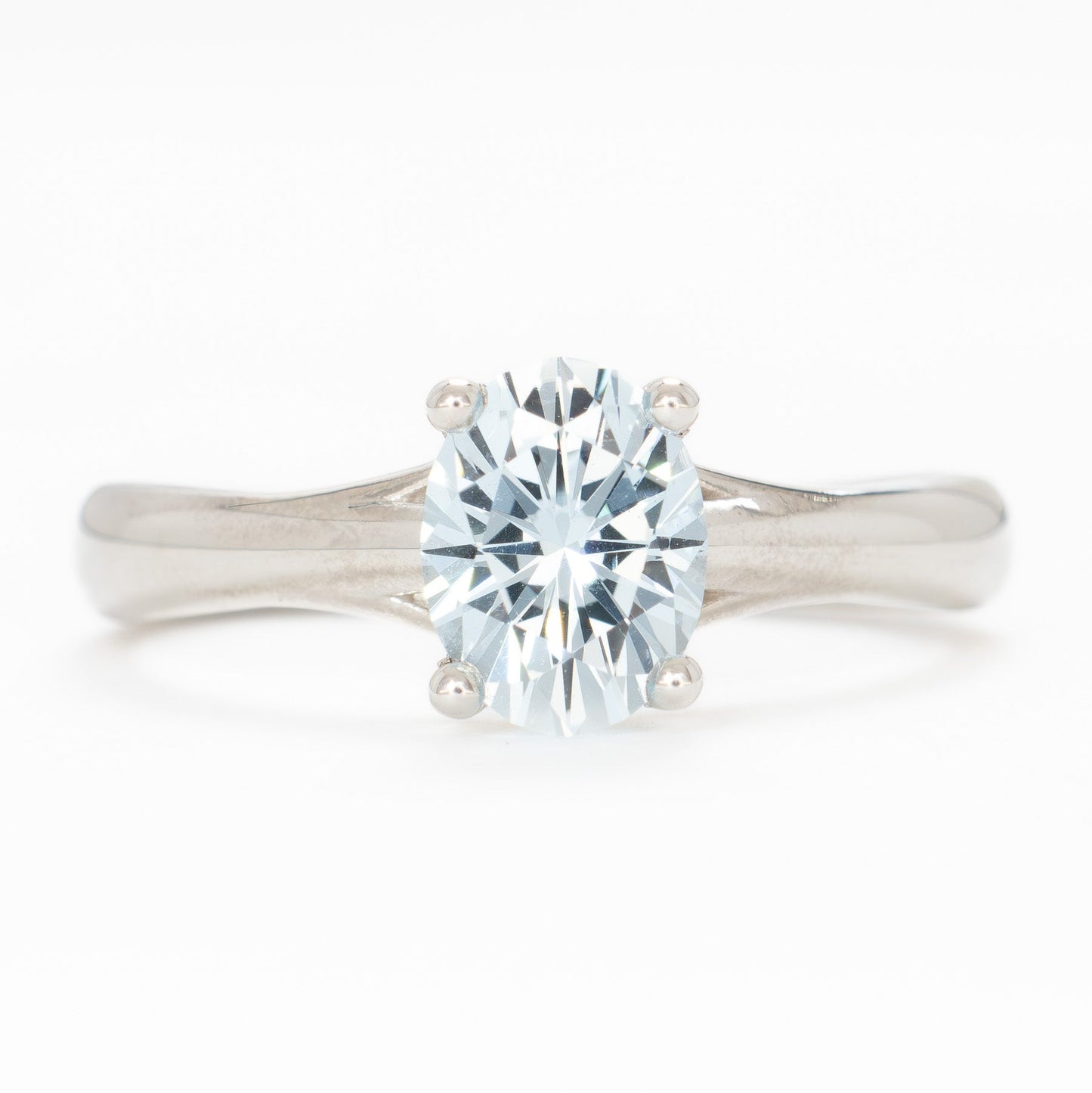 courtney solitaire ring with oval light blue lab sapphire