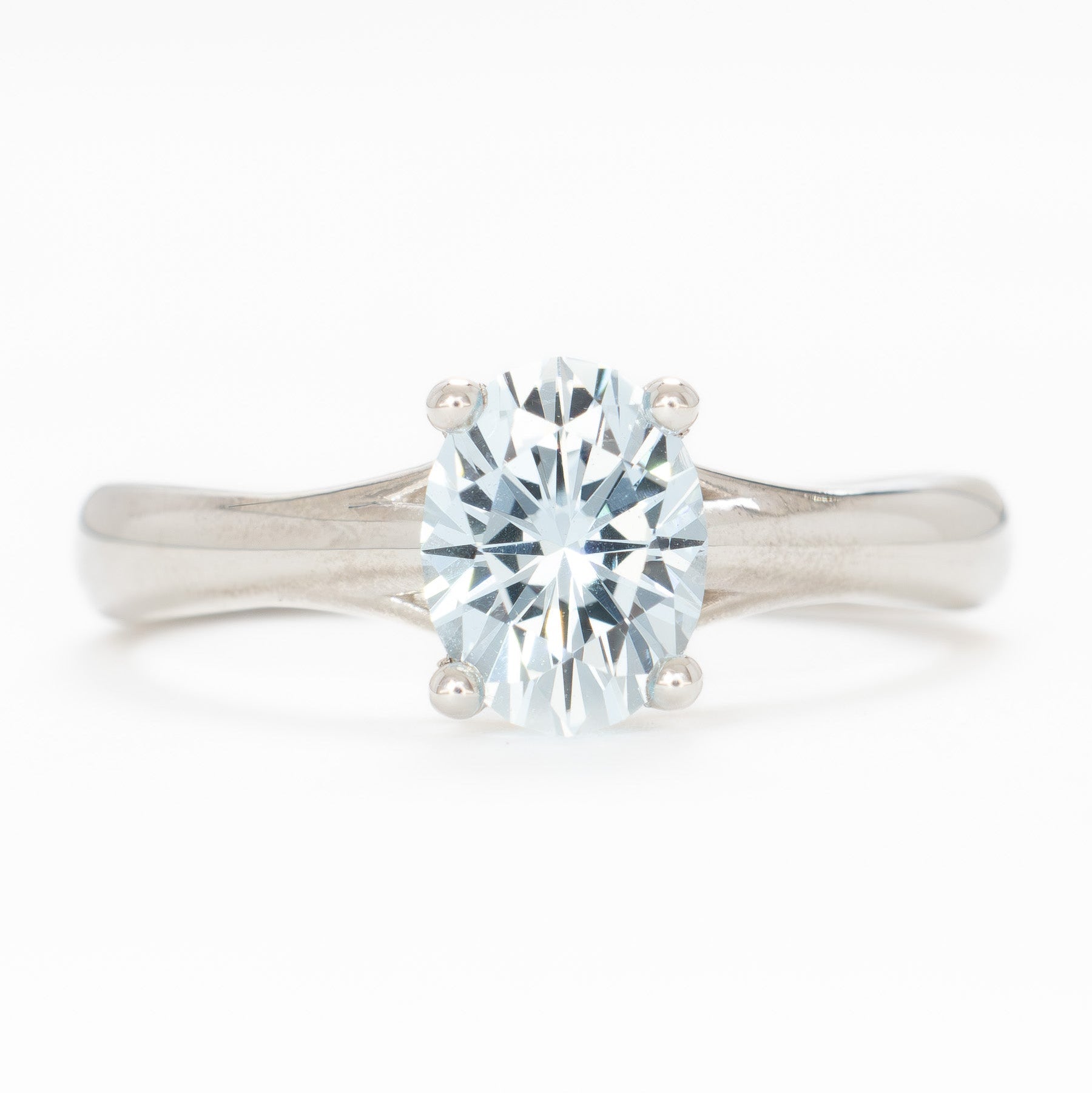 courtney solitaire ring with oval light blue lab sapphire