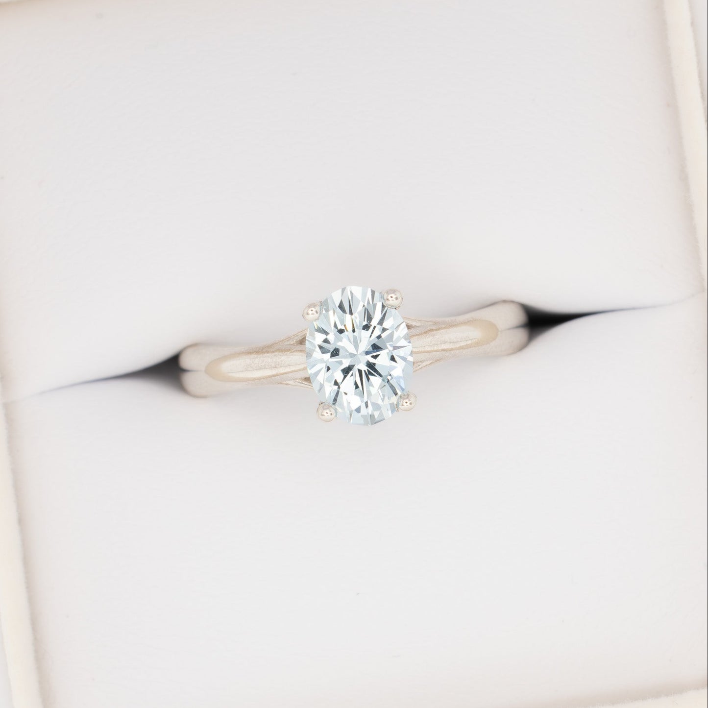 courtney solitaire ring with oval light blue lab sapphire