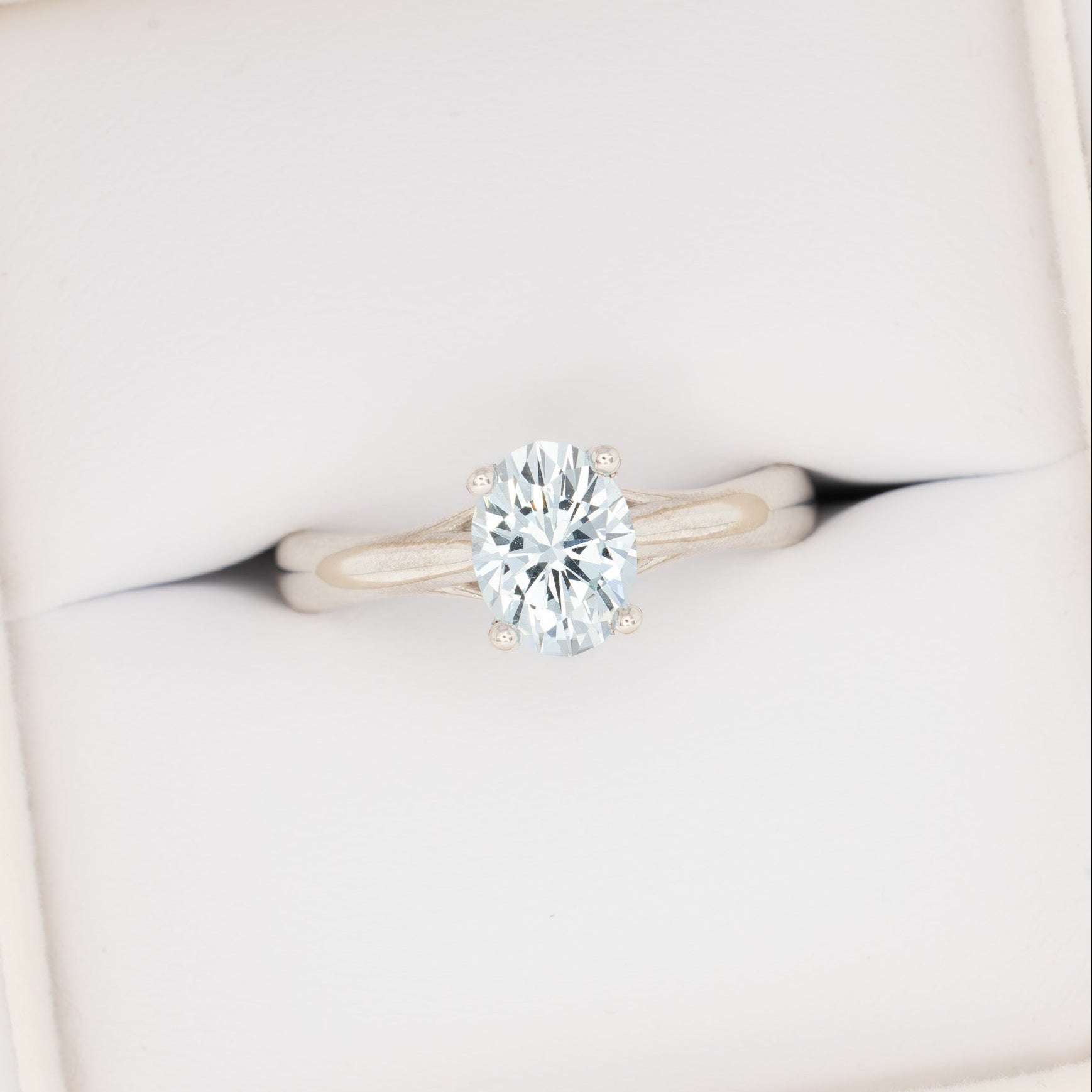 courtney solitaire ring with oval light blue lab sapphire