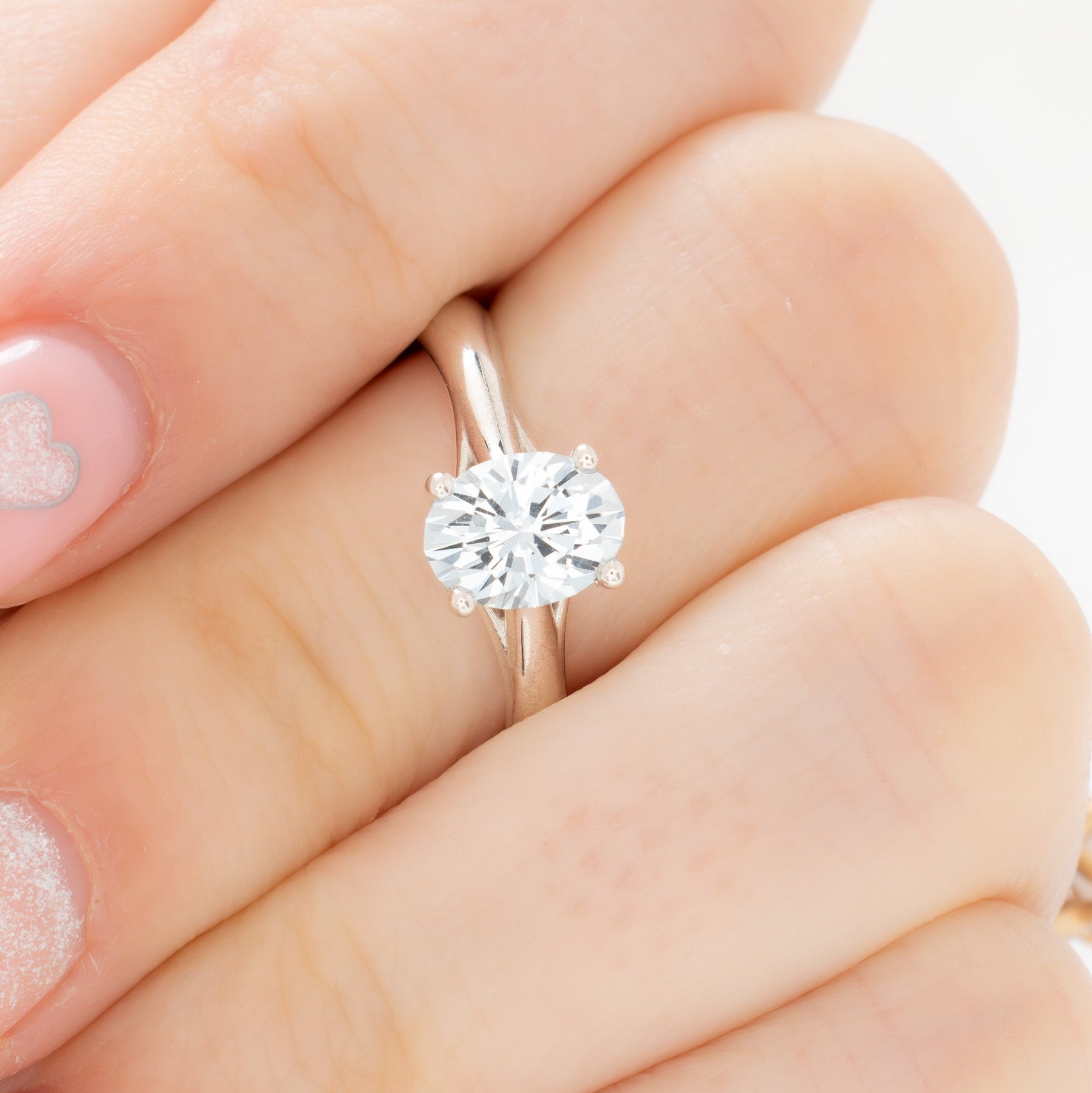 courtney solitaire ring with oval light blue lab sapphire