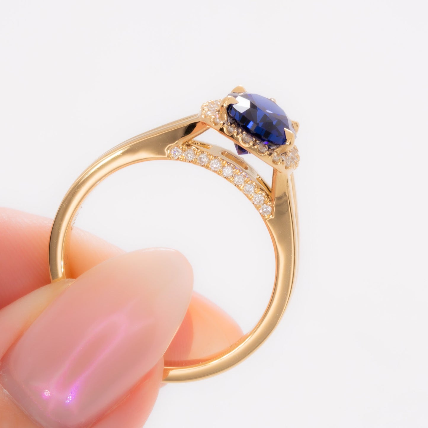 cove halo split shank engagement ring with blue pear lab sapphire