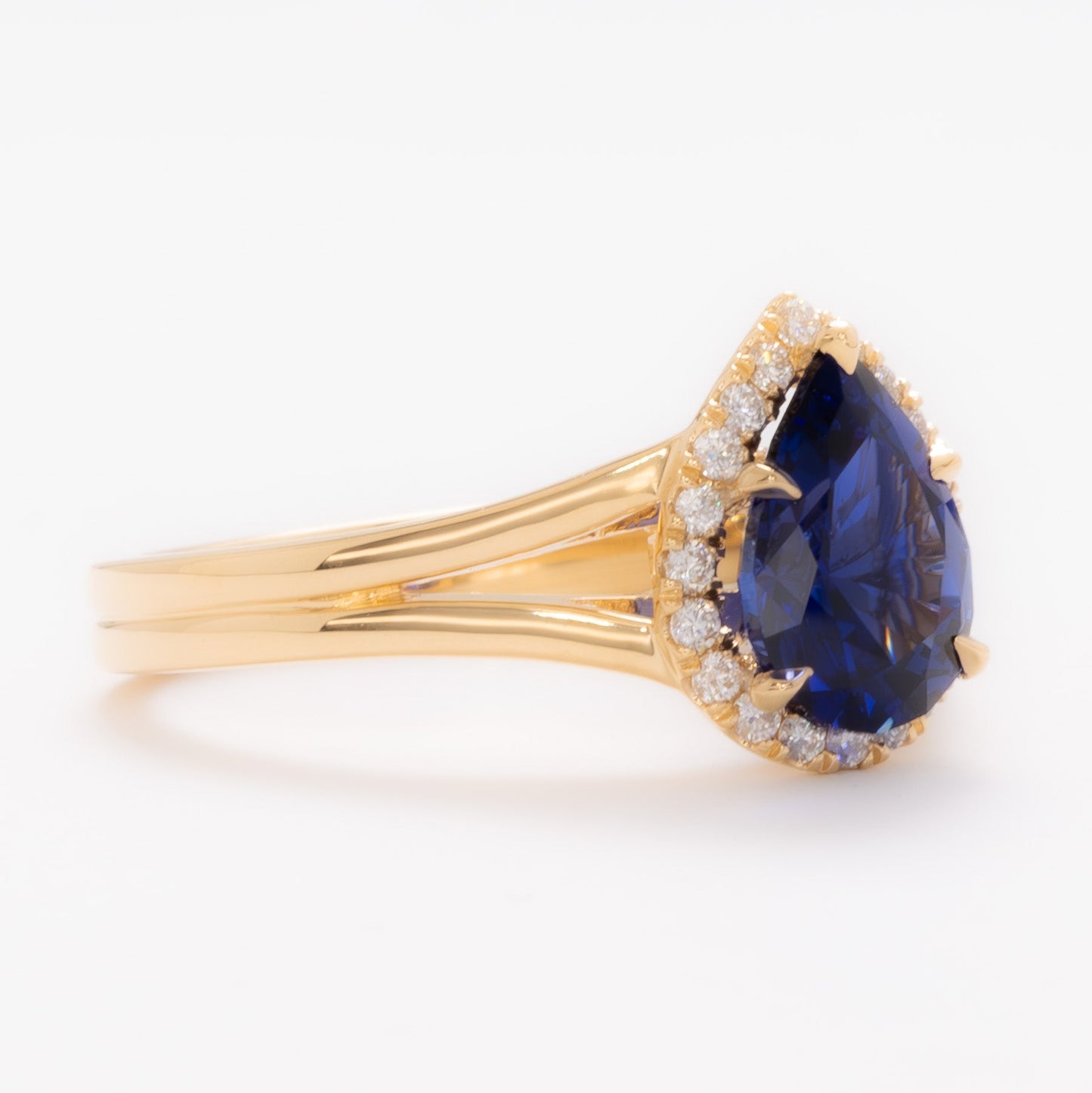 cove halo split shank engagement ring with blue pear lab sapphire