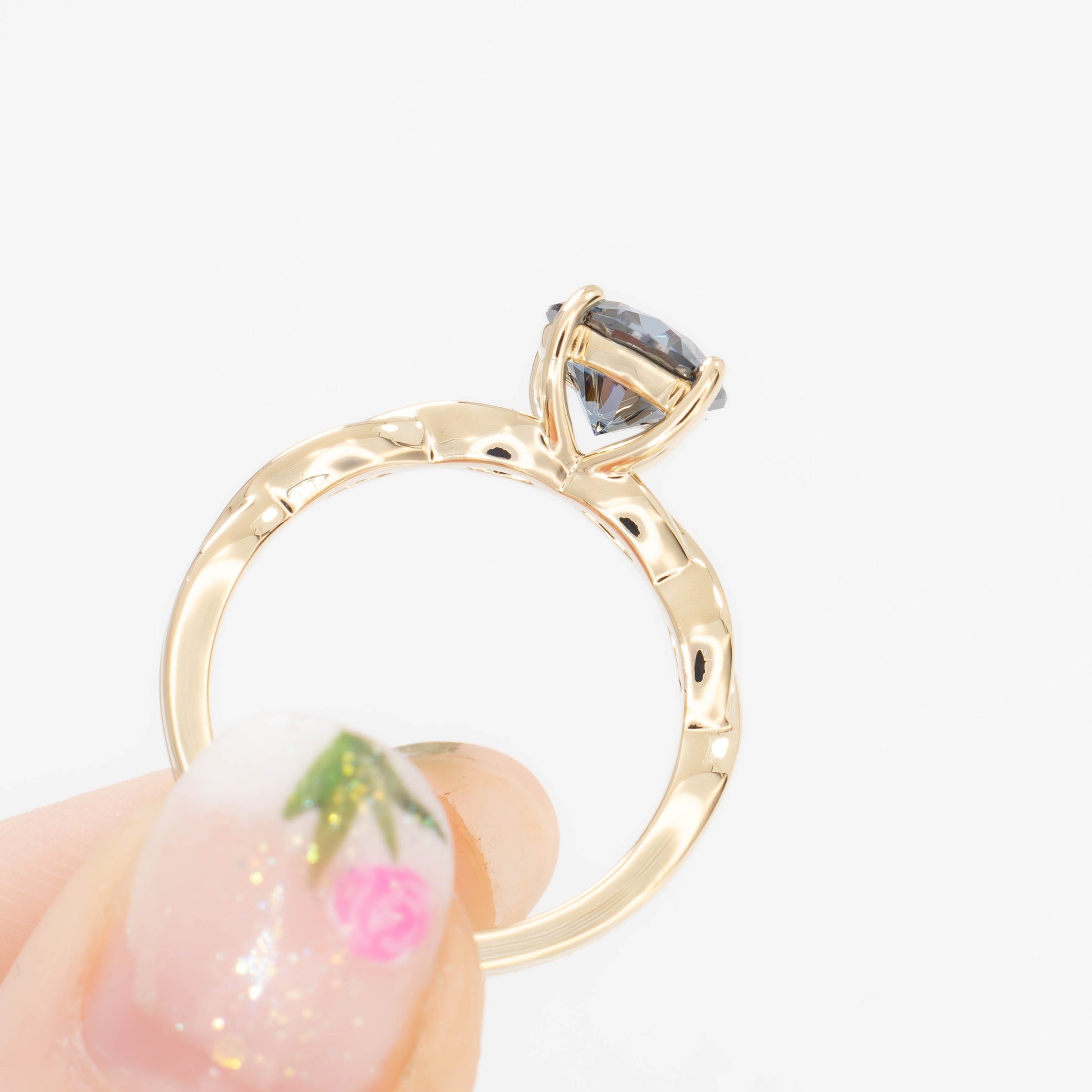 cressida solitaire engagement ring in yellow gold with blue moissanite round brilliant