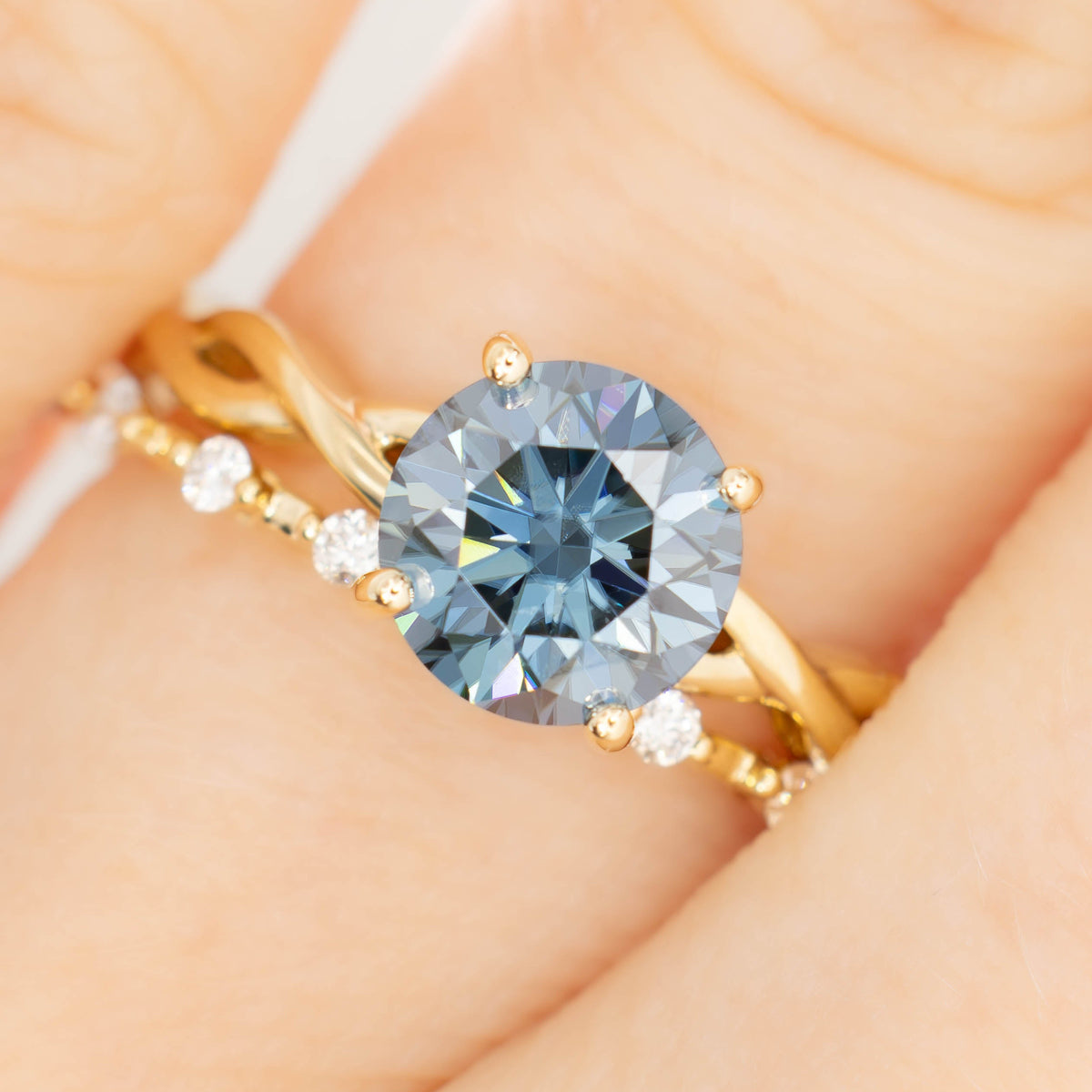 cressida solitaire ring with round blue moissanite