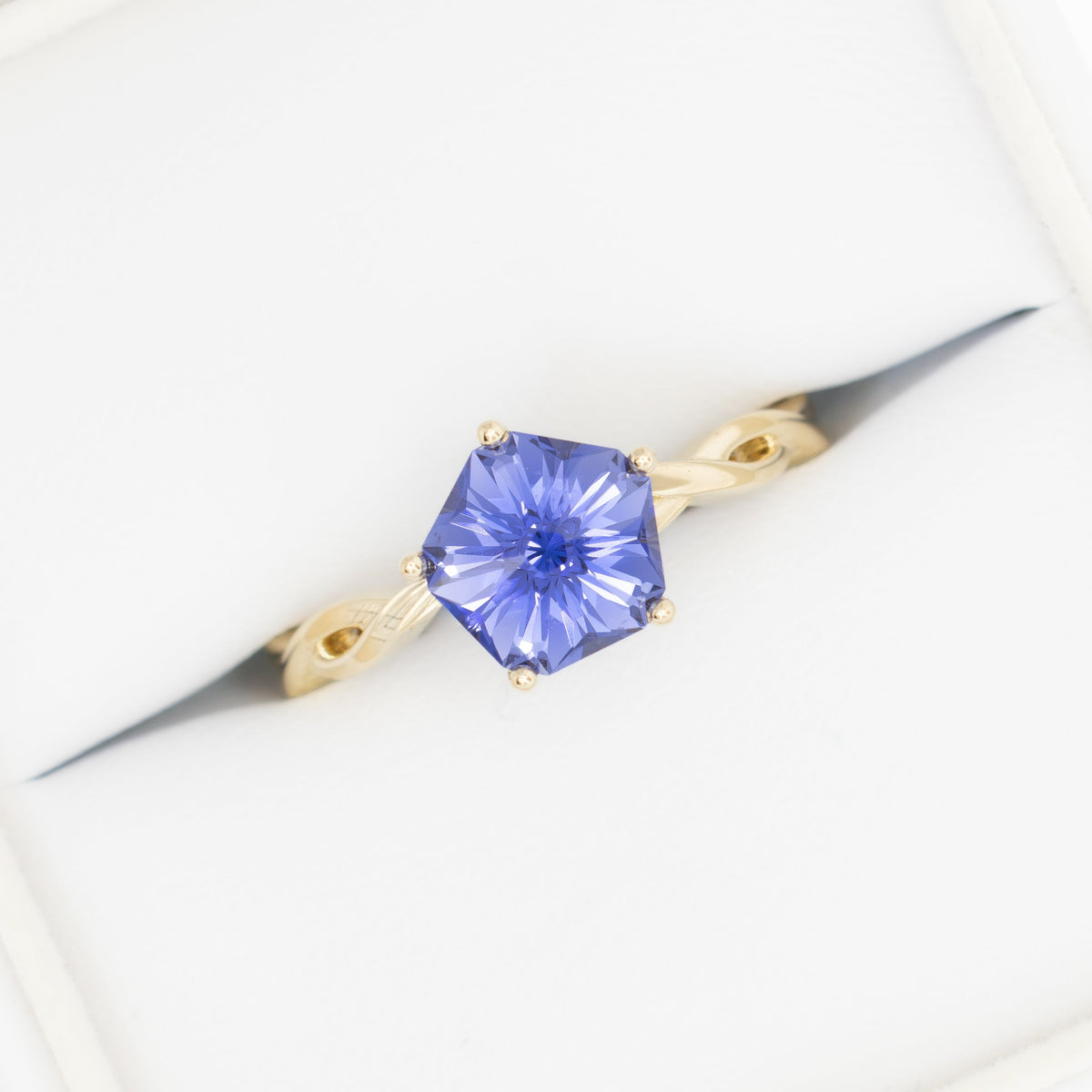 cressida solitaire ring with twisted band in yellow gold and hanami flower periwinkle blue lab sapphire