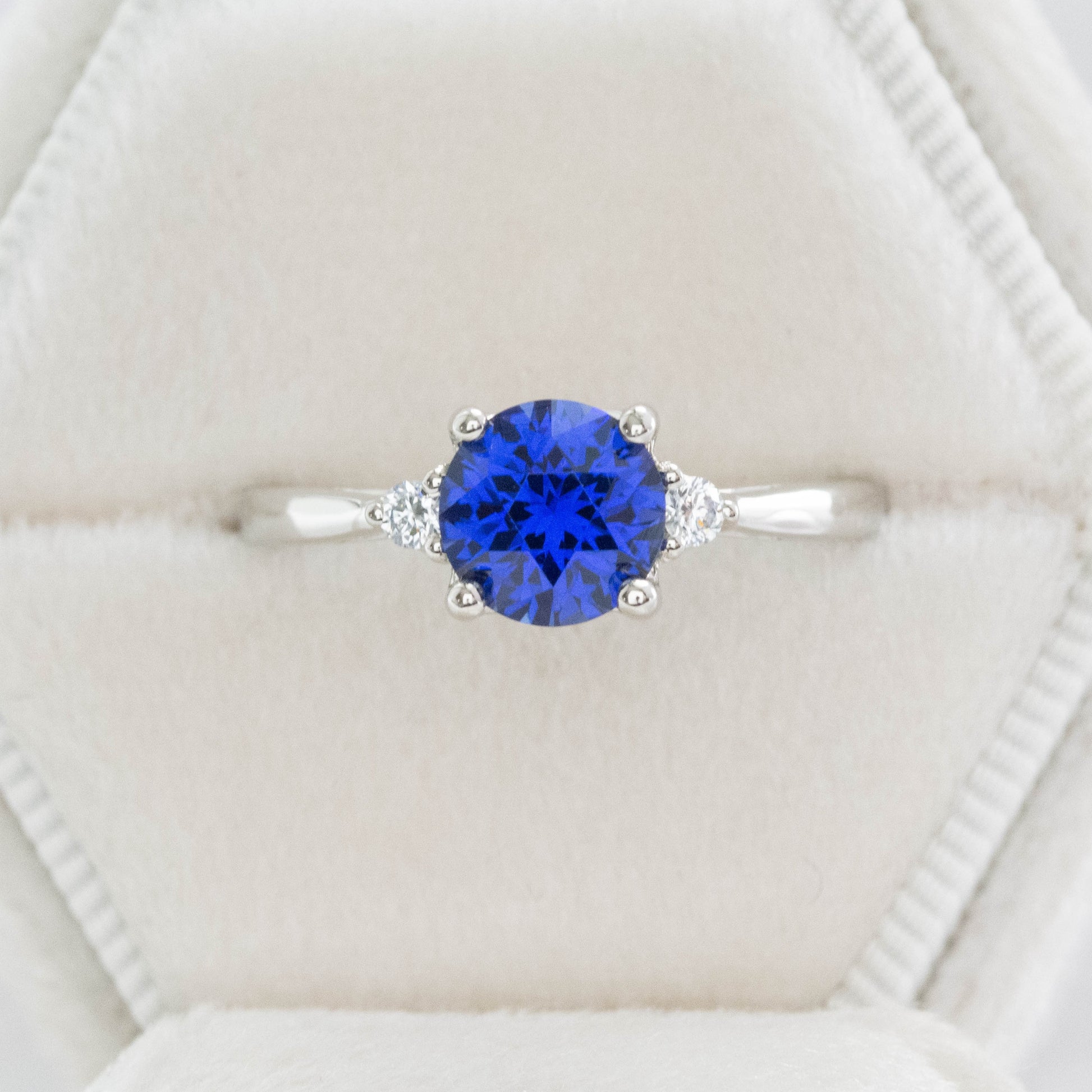 custom engagement ring, three stone with lab sapphire