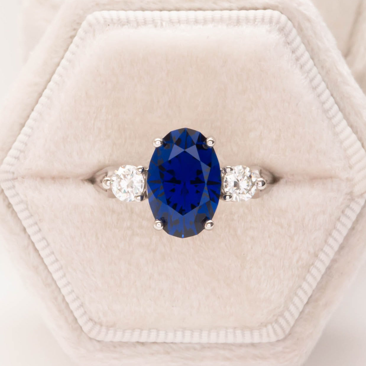 oval royal blue lab sapphire three stone engagement ring