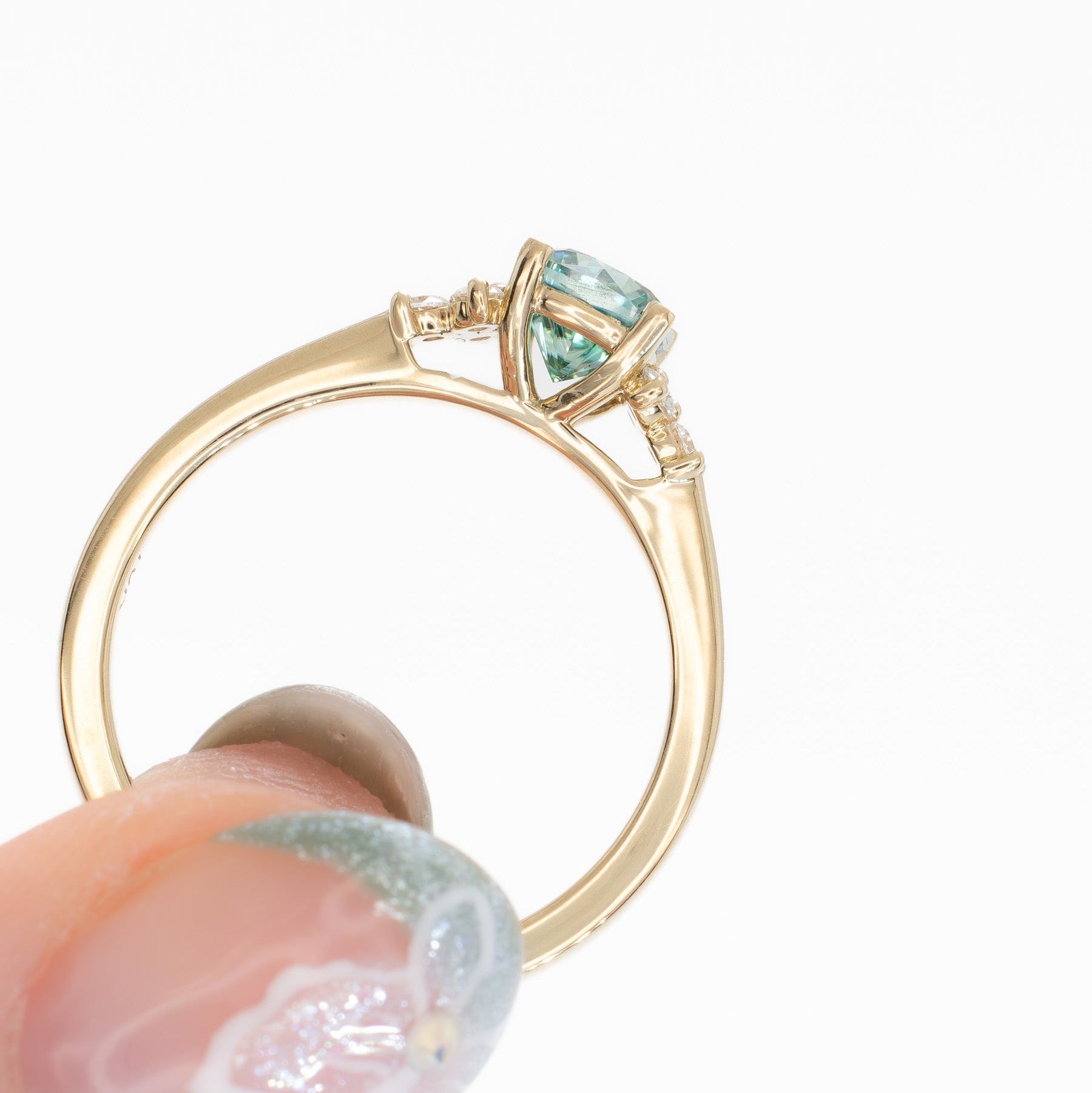 cynthia engagement ring with green moissanite cushion in yellow gold