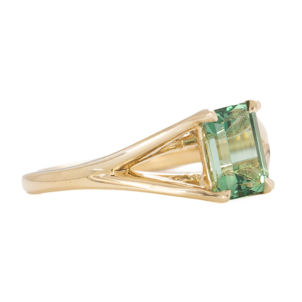 cyres split shank solitaire ring in yellow gold with step cut green lab sapphire