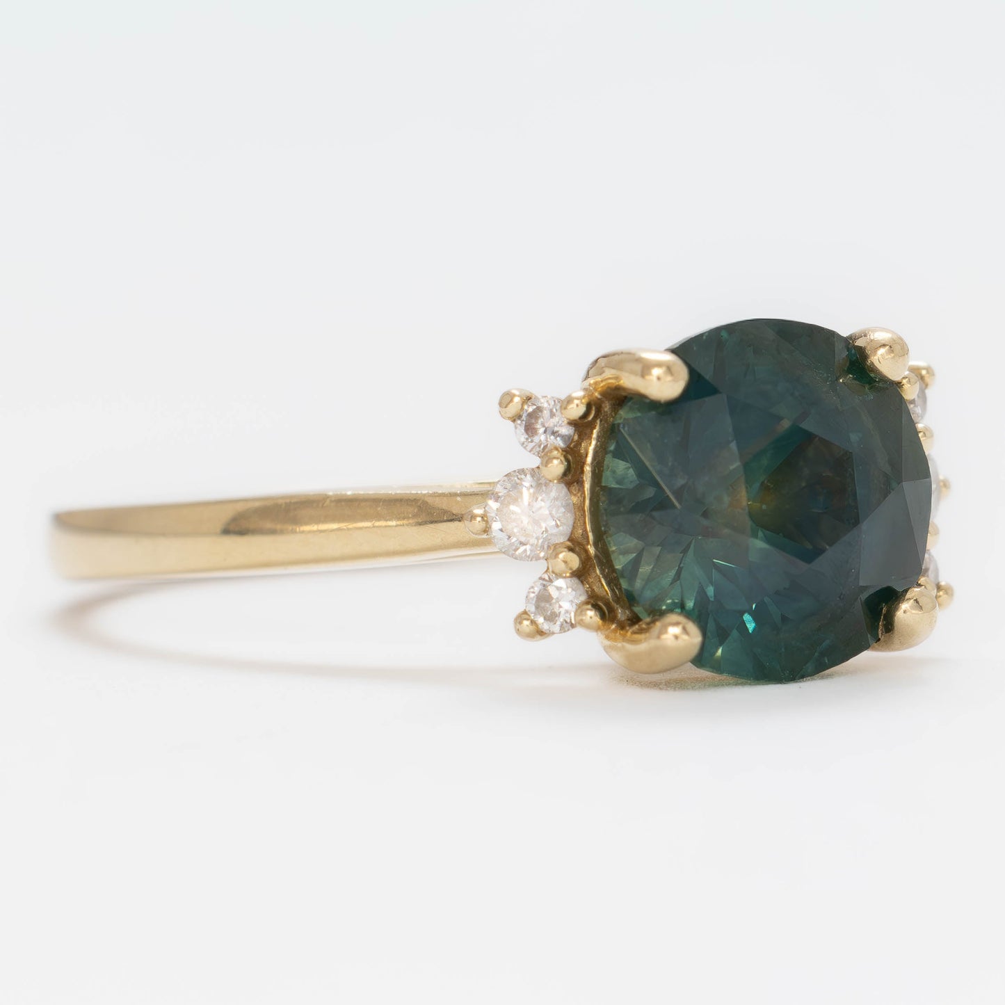 eclipse accented engagement ring with round  blue-green montana sapphire