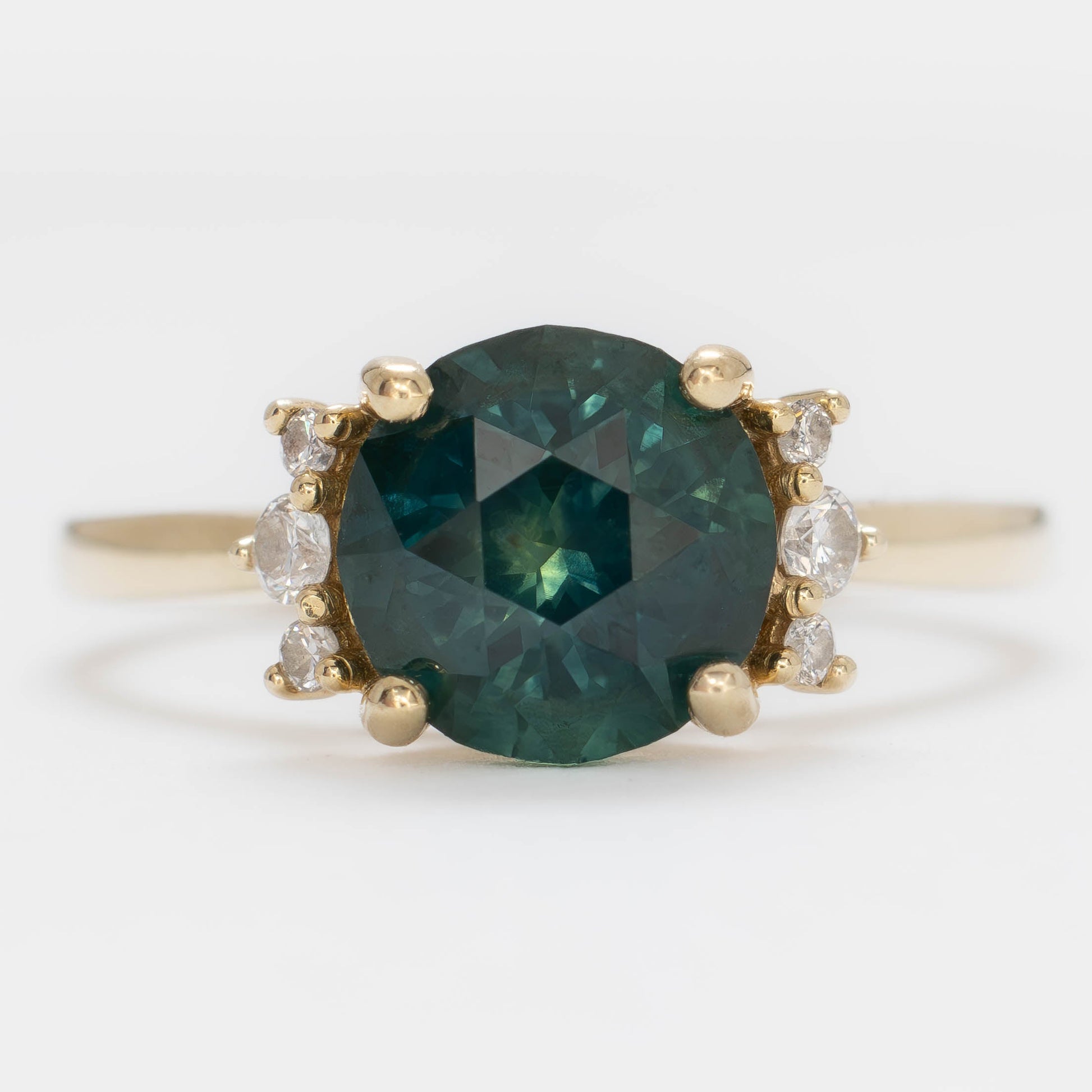 eclipse accented engagement ring with round  blue-green montana sapphire