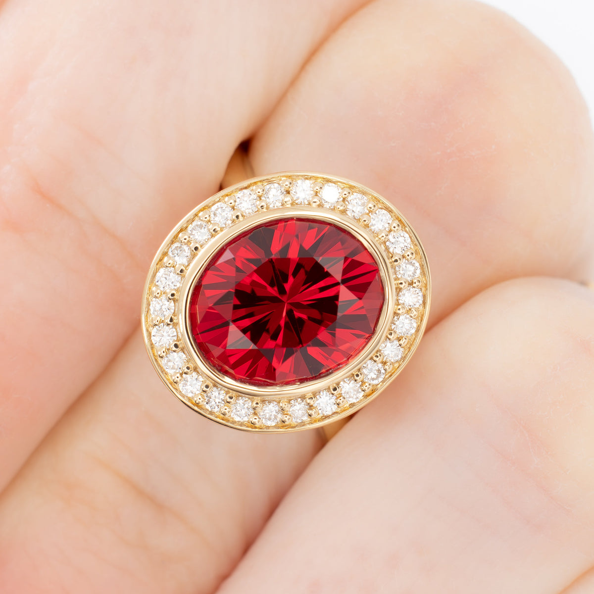 eleanor art deco halo ring in yellow gold with oval lab ruby