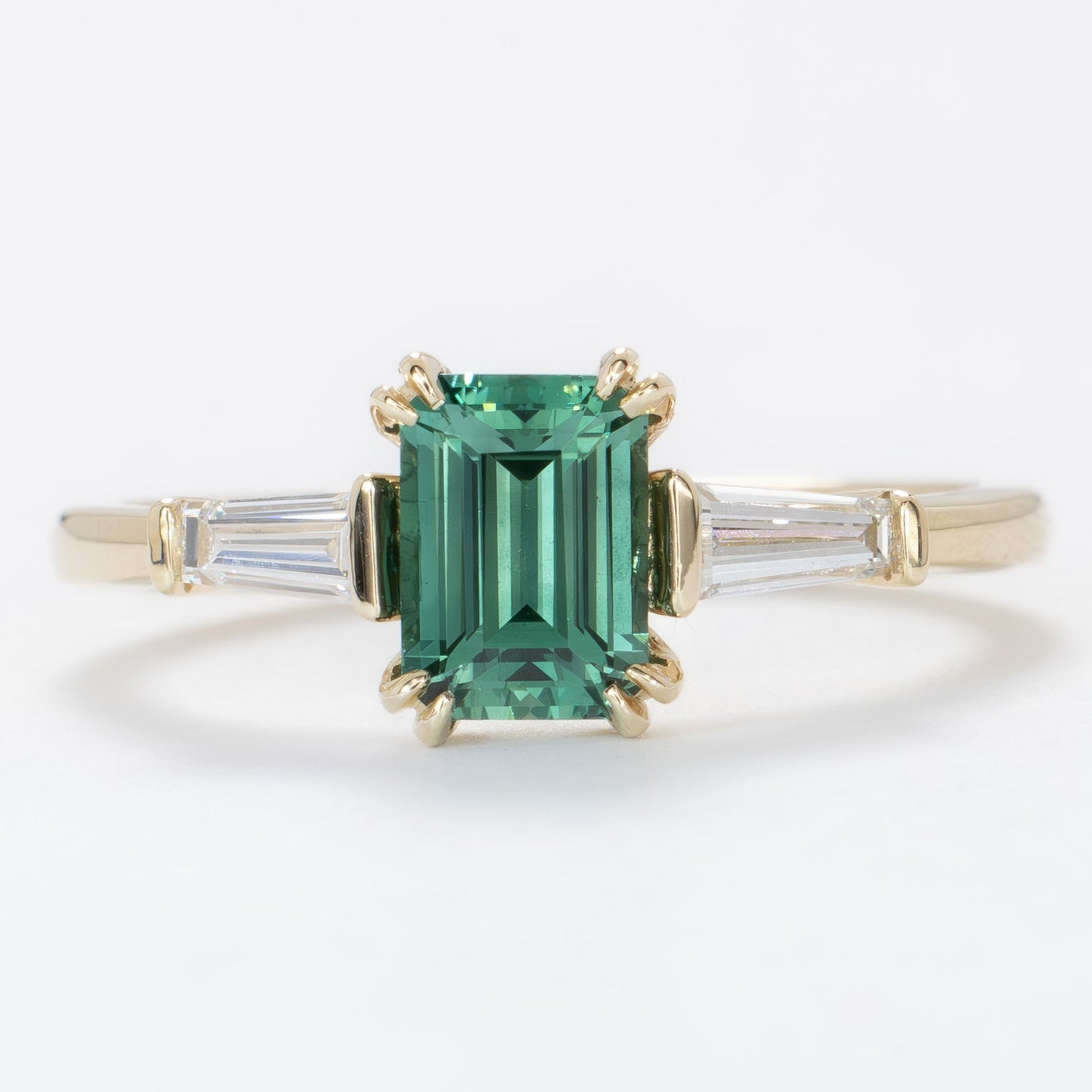 elyna ring with step cut green lab sapphire in yellow gold