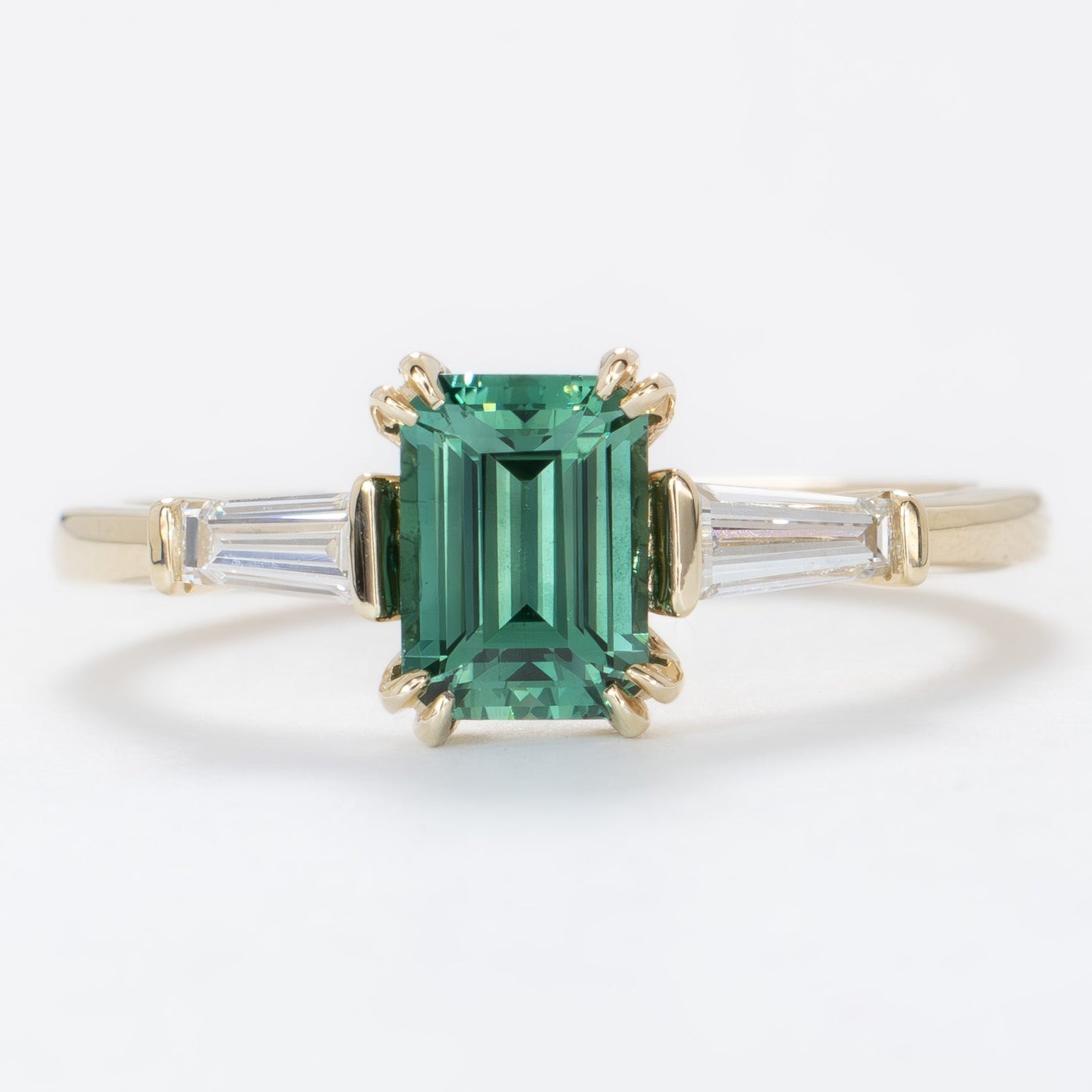 elyna ring with step cut green lab sapphire in yellow gold