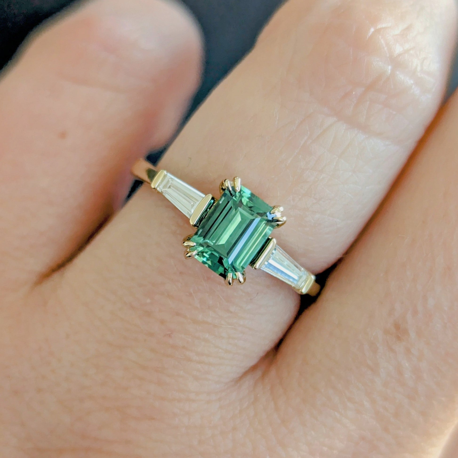 elyna three stone engagement ring with lab emerald