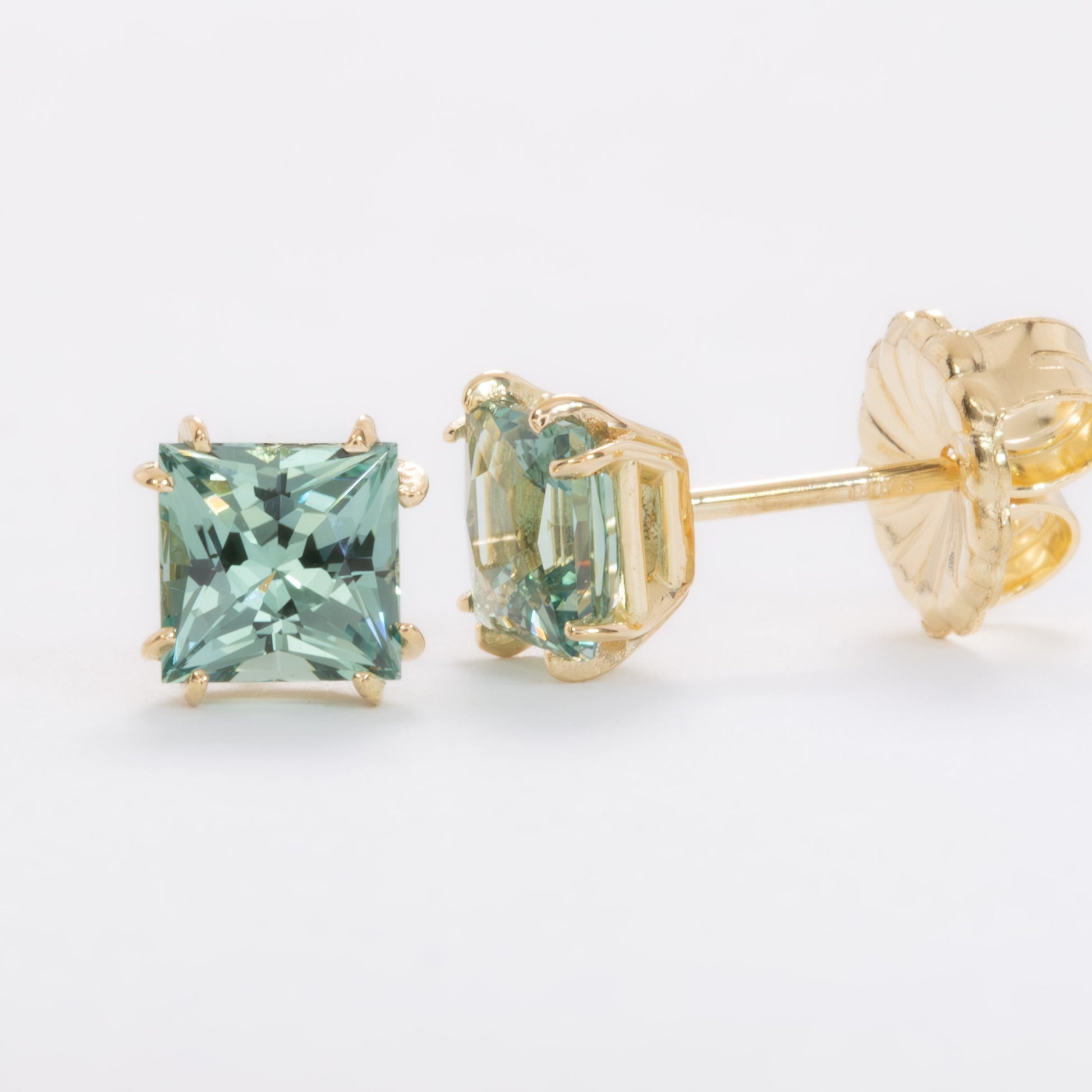 emma earrings in yellow gold with princess cut green lab sapphires