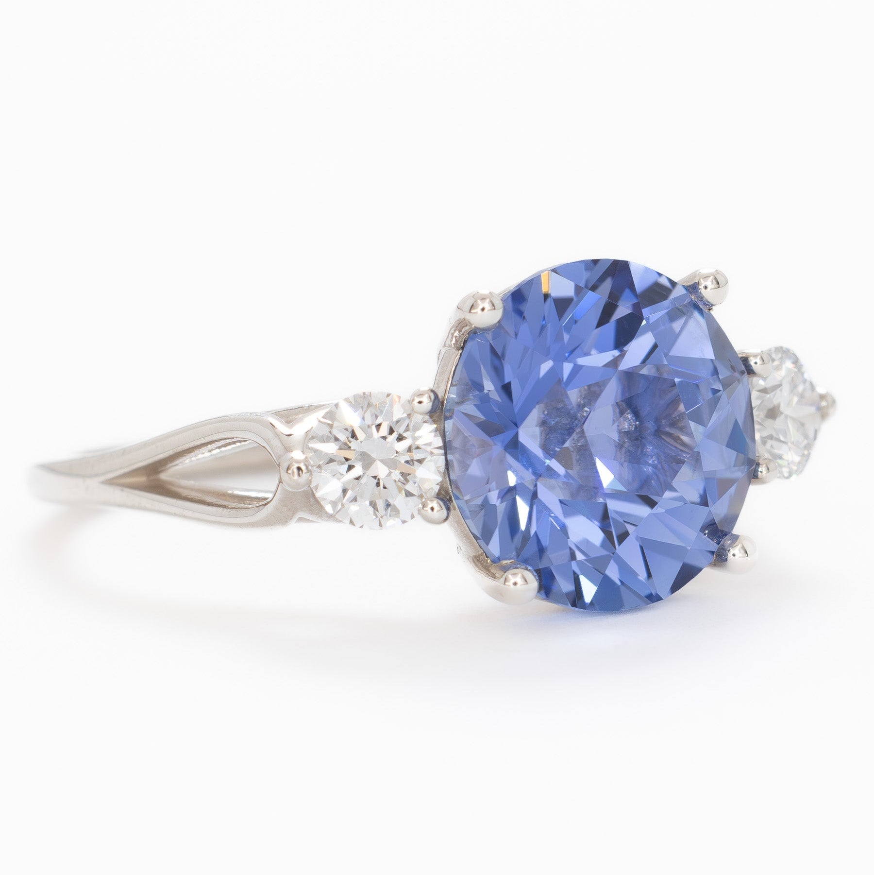 emryn three stone ring with round periwinkle blue lab sapphire