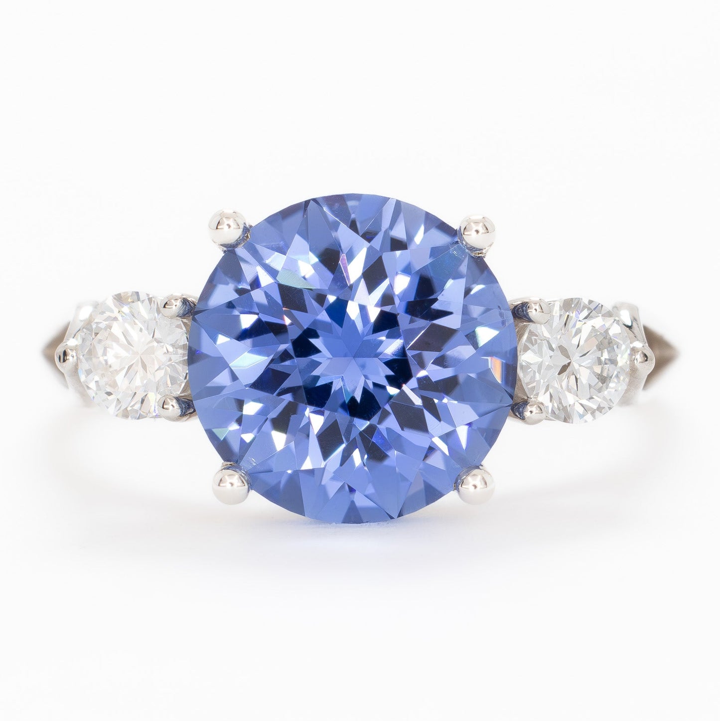 emryn three stone ring with round periwinkle blue lab sapphire