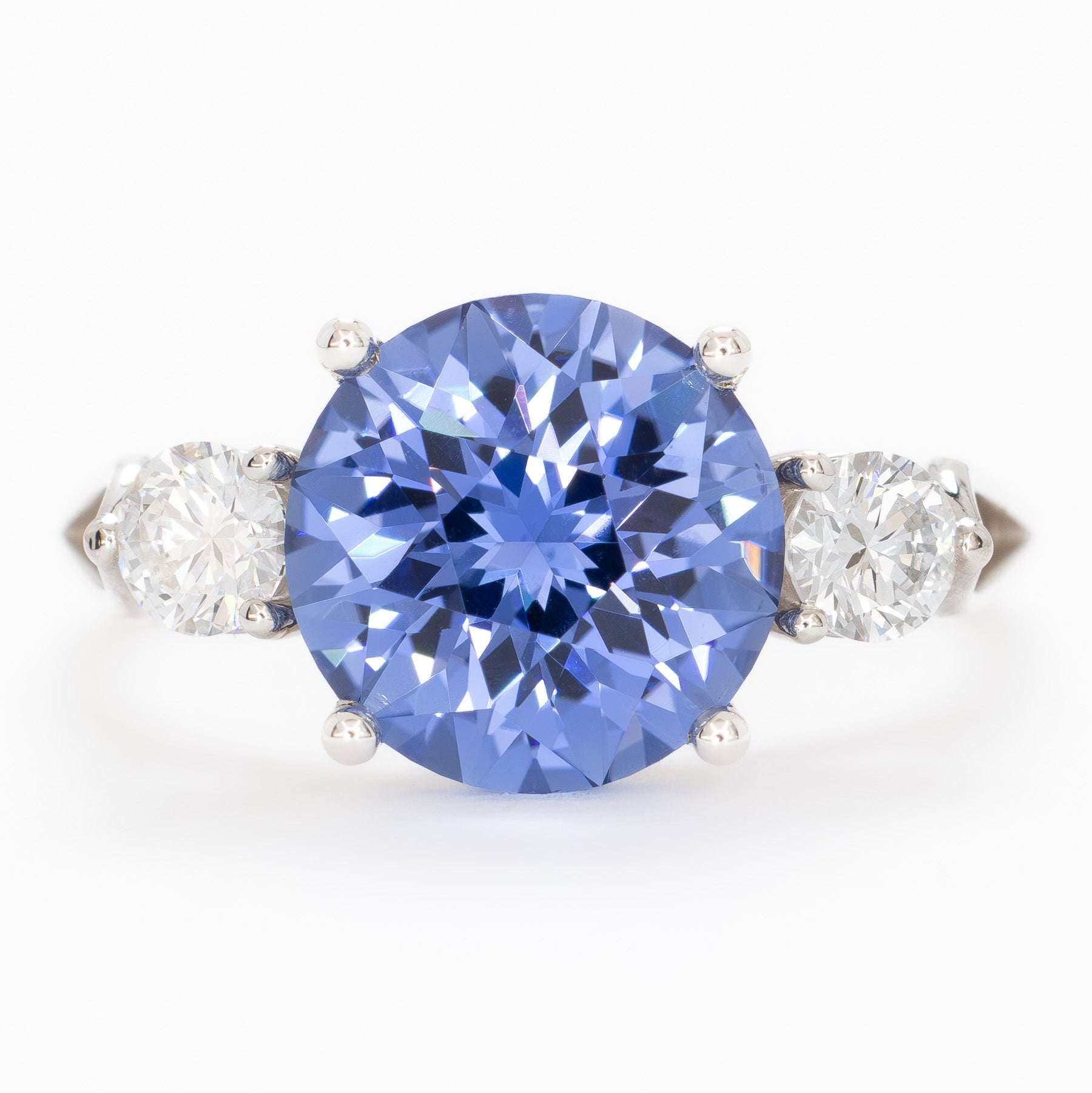 emryn three stone ring with round periwinkle blue lab sapphire