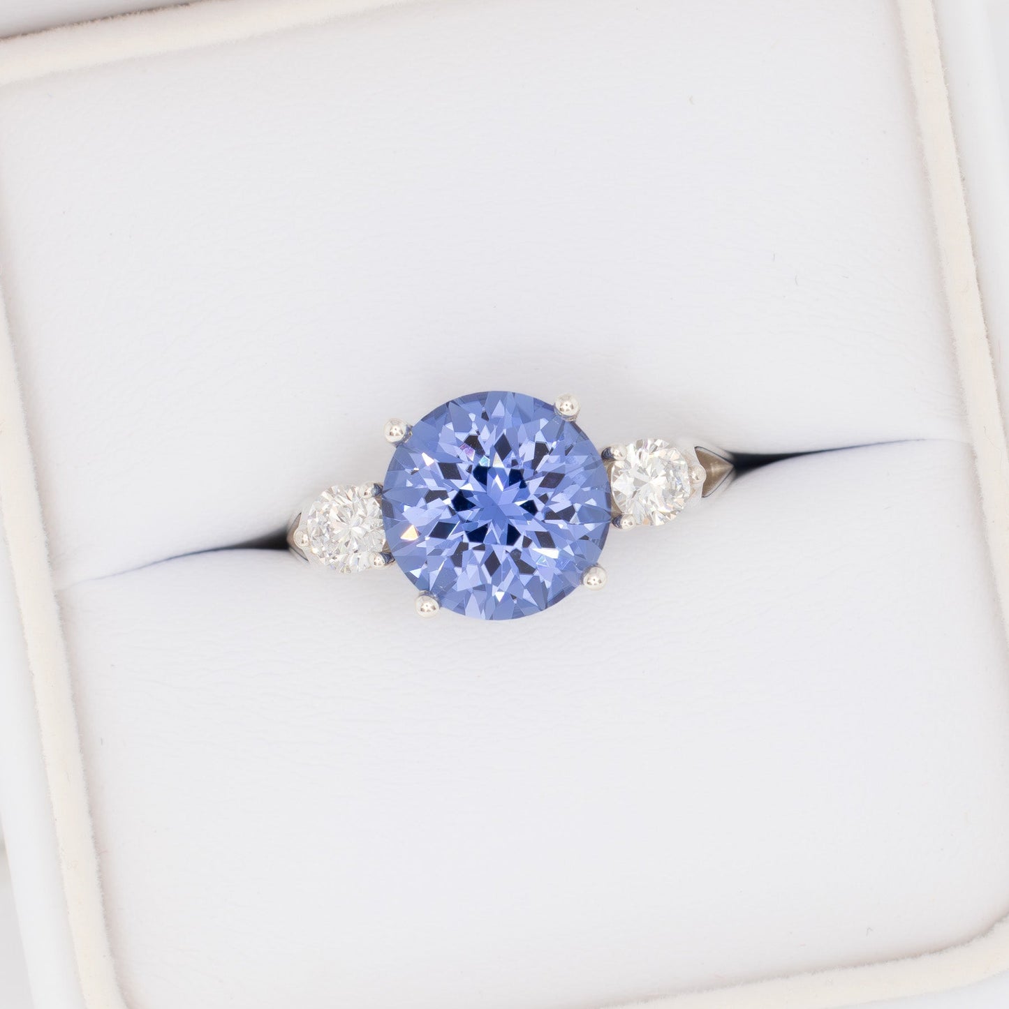 emryn three stone ring with round periwinkle blue lab sapphire