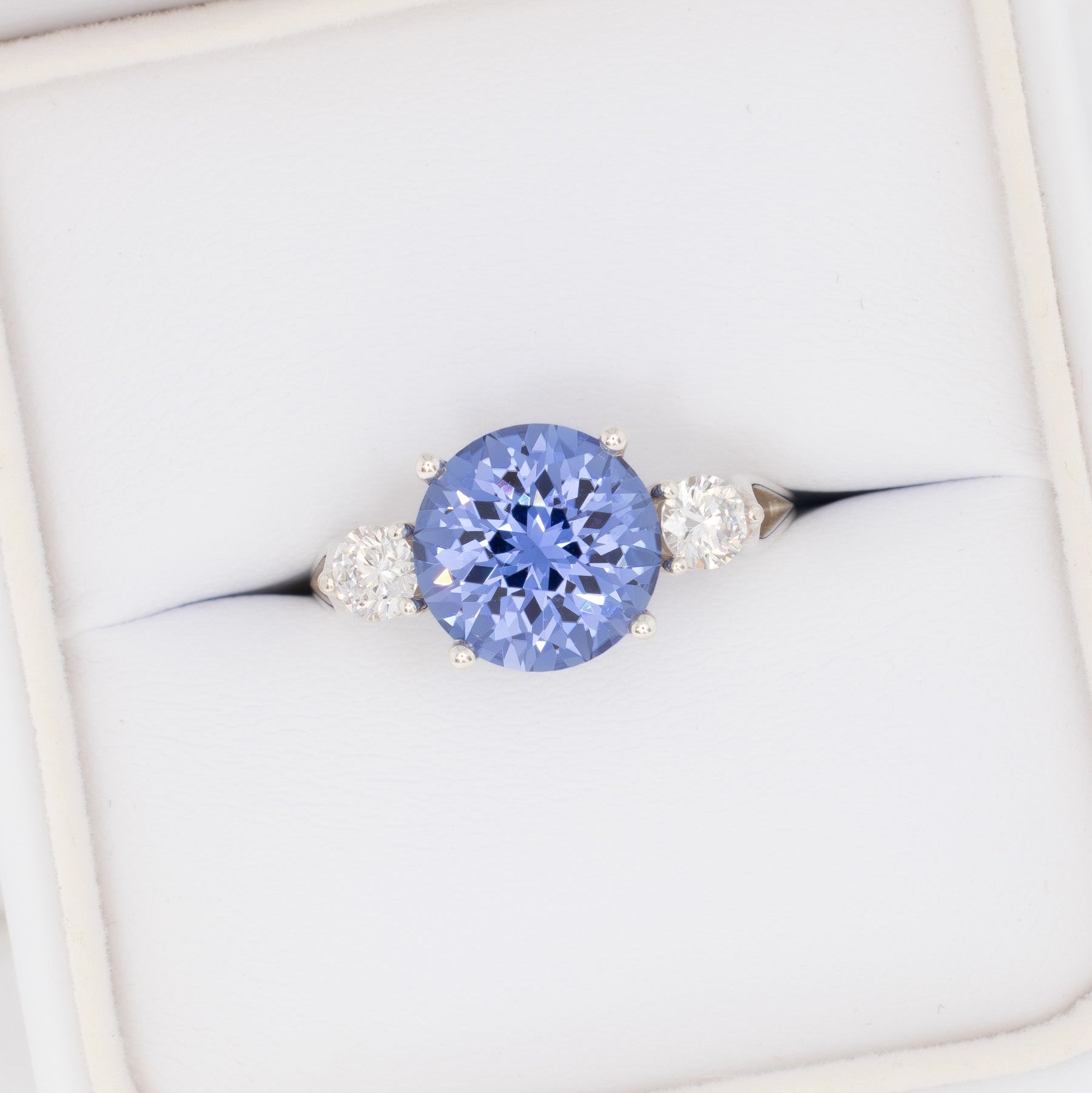 emryn three stone ring with round periwinkle blue lab sapphire