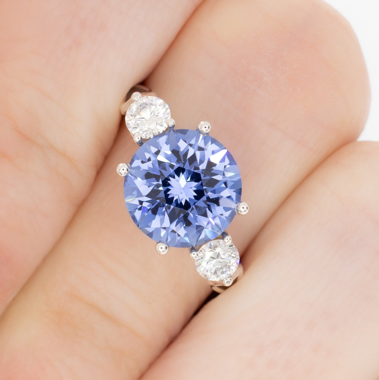 emryn three stone ring with round periwinkle blue lab sapphire