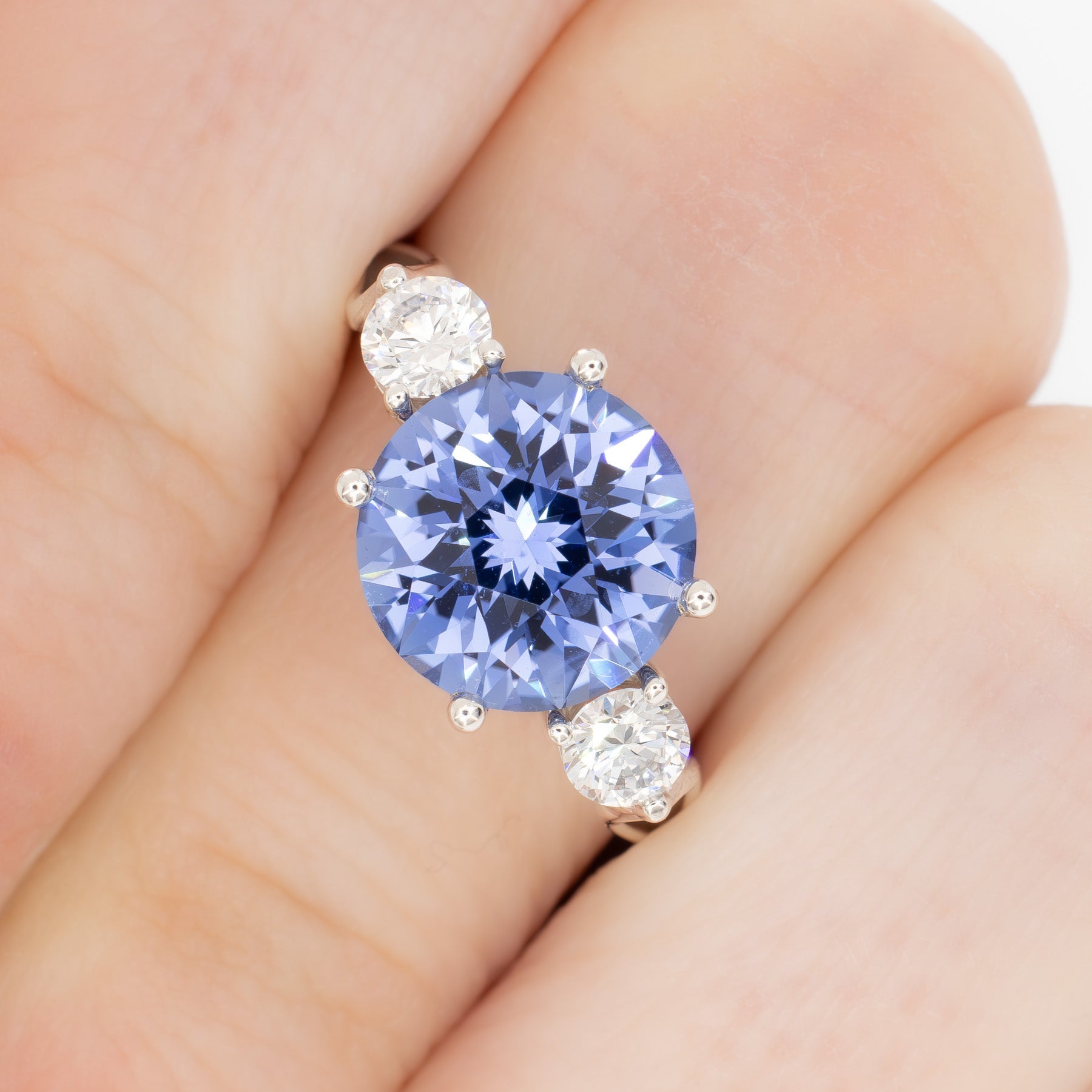 emryn three stone ring with round periwinkle blue lab sapphire