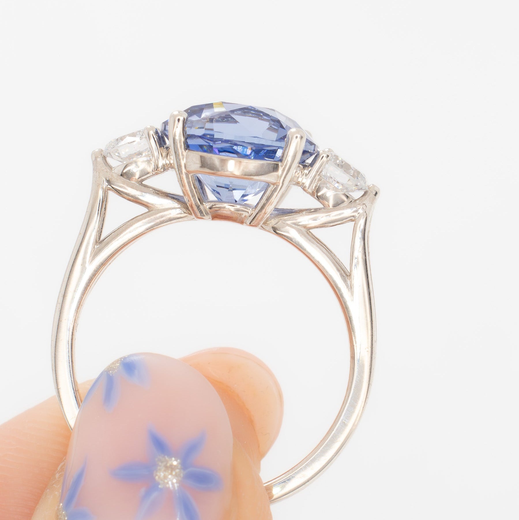 emryn three stone ring with round periwinkle blue lab sapphire