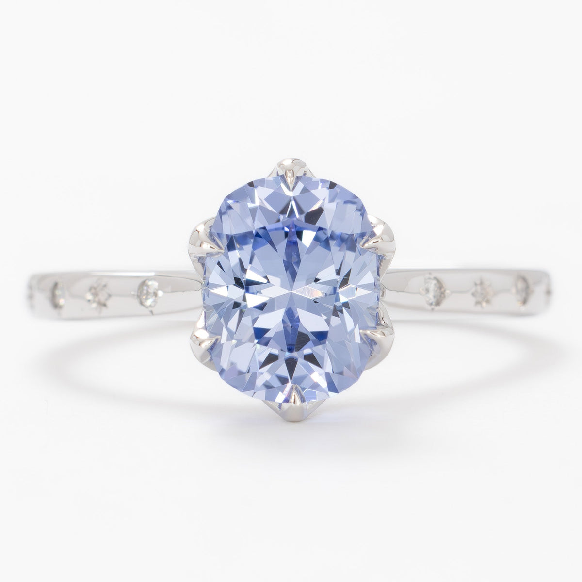 estel accented ring in white gold with elongated cushion light blue lab sapphire