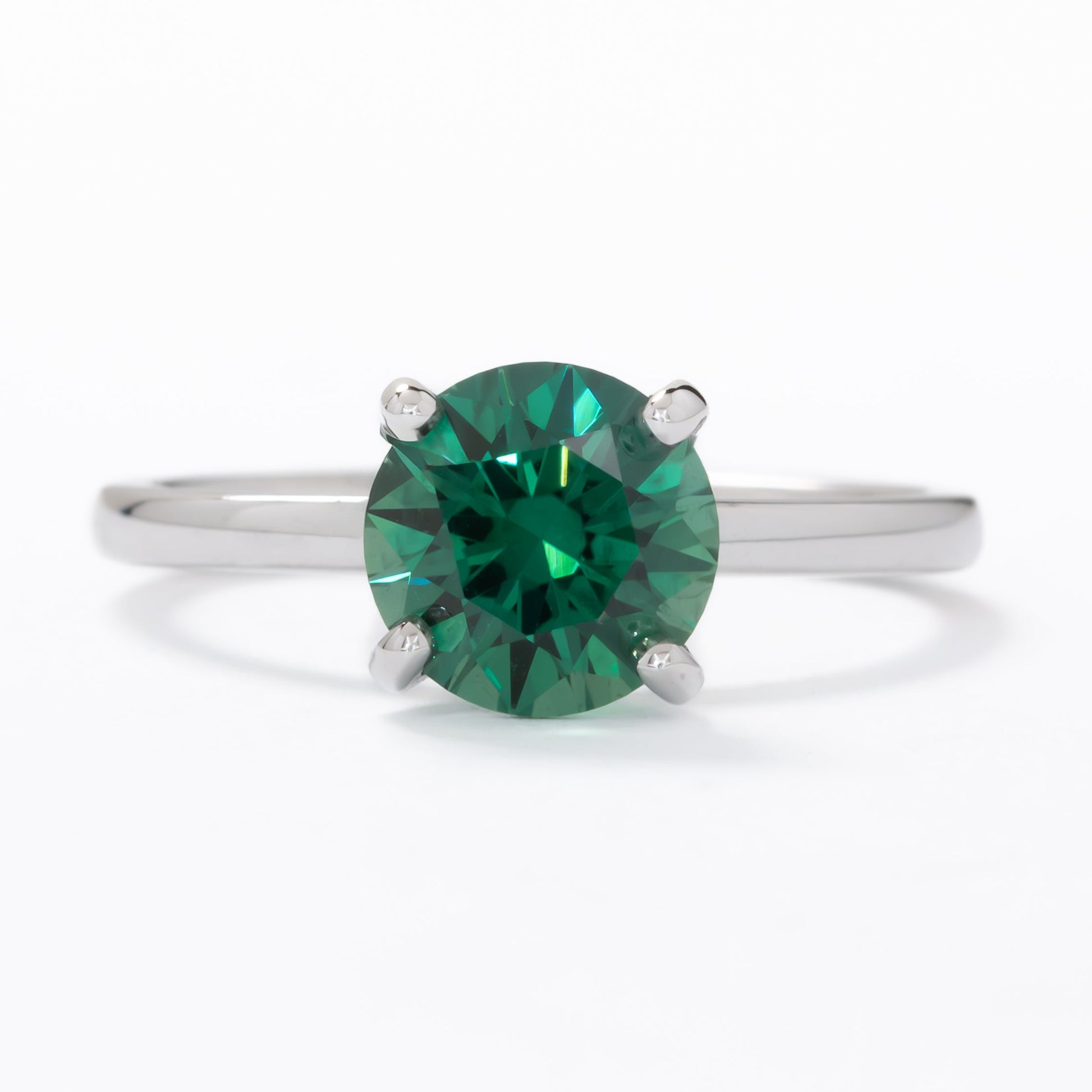 evie engagement ring with green lab sapphire round