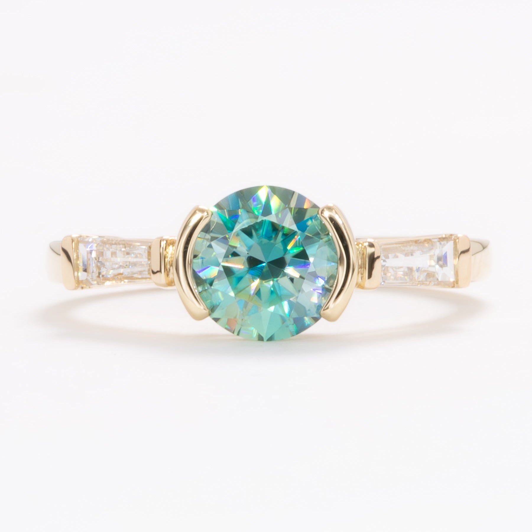 ezri three stone engagement ring with round blue-green moissanite
