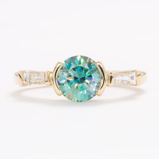 ezri three stone engagement ring with round blue-green moissanite