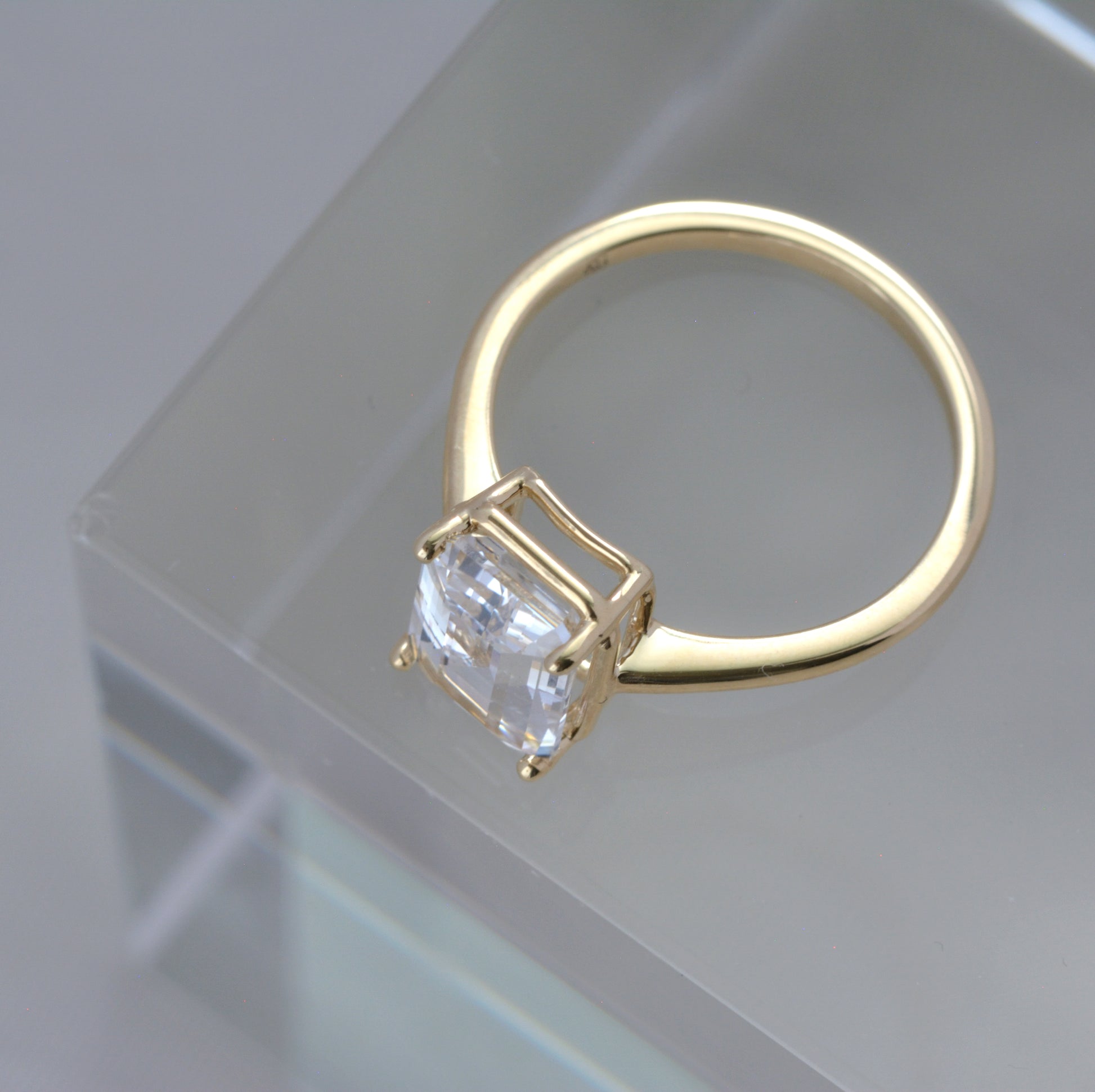 faux bezel engagement ring with lab sapphire