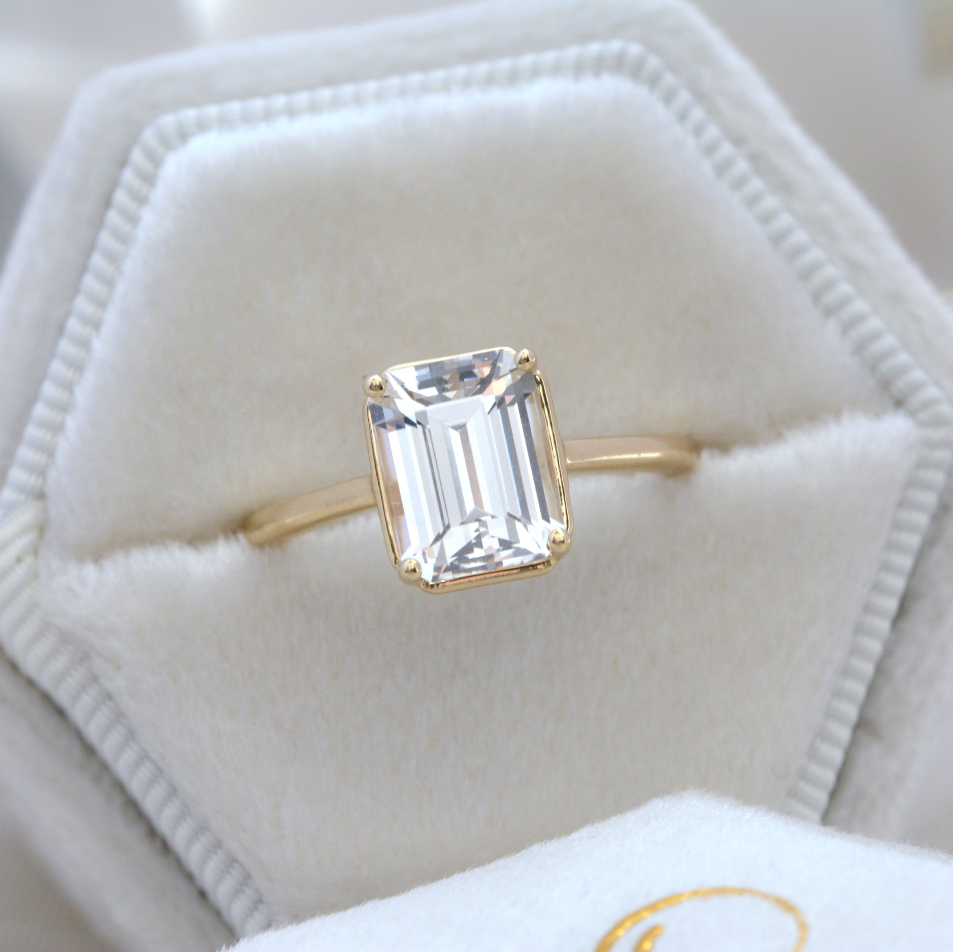 faux bezel engagement ring with lab sapphire