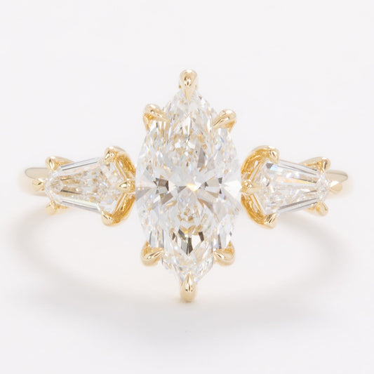 felicity three stone engagement ring with marquise lab diamond