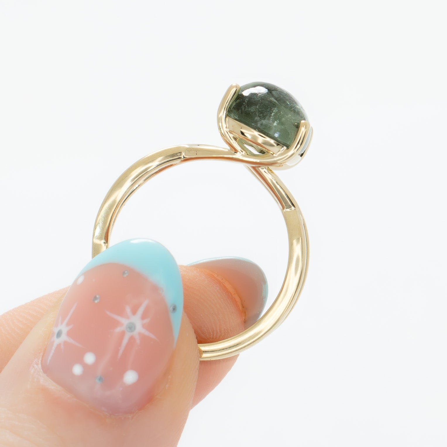 fifer solitaire ring with green tourmaline pear cabochon in yellow gold