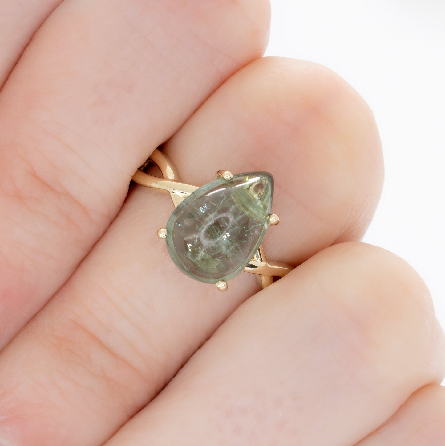 fifer solitaire ring with green tourmaline pear cabochon in yellow gold