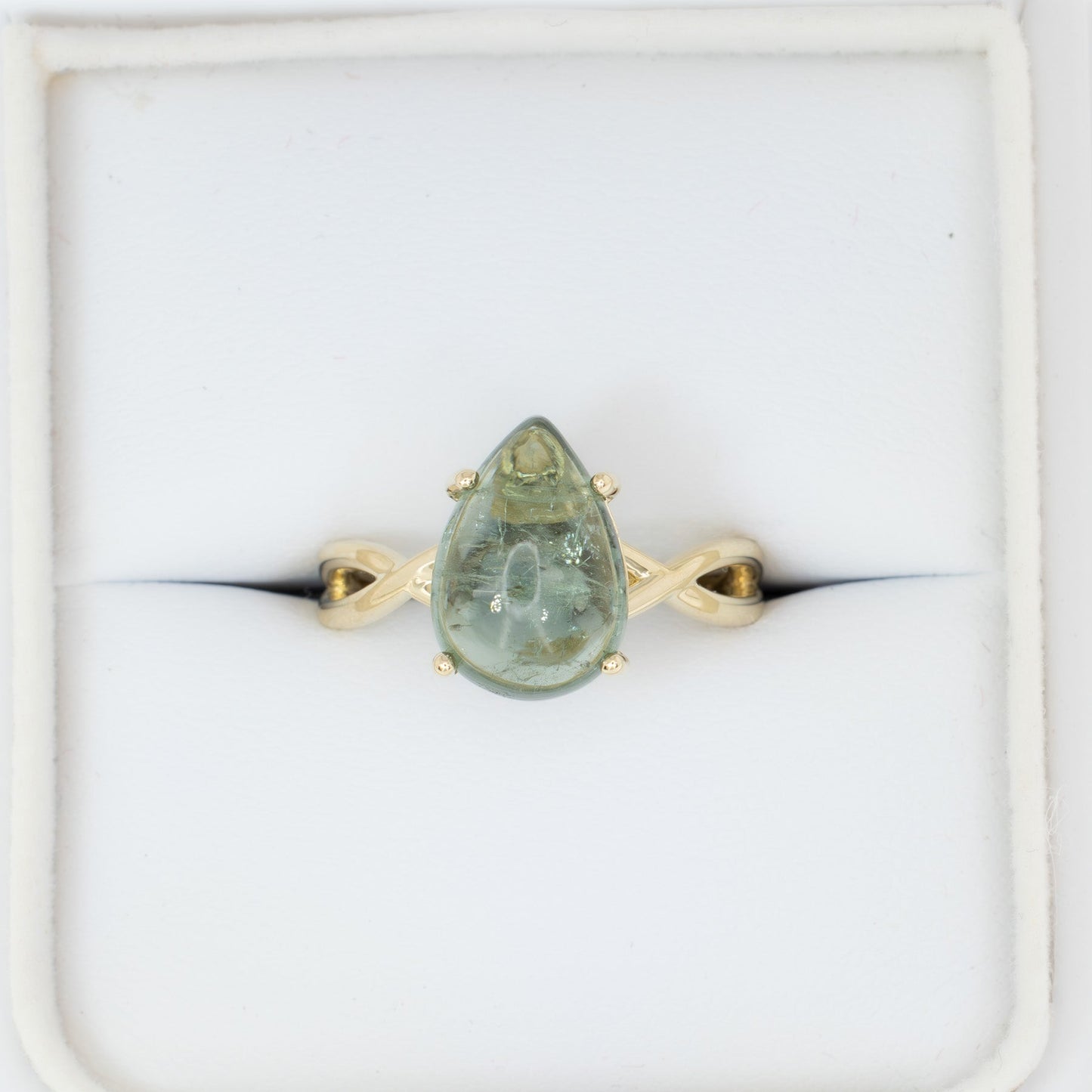 fifer solitaire ring with green tourmaline pear cabochon in yellow gold