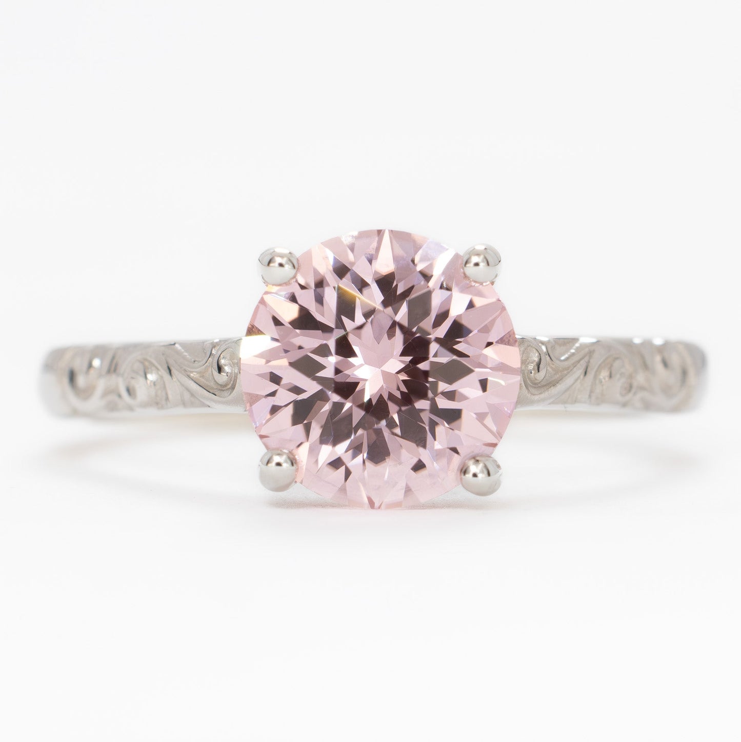 fleur nature inspired solitaire engagement ring with pink lab sapphire round