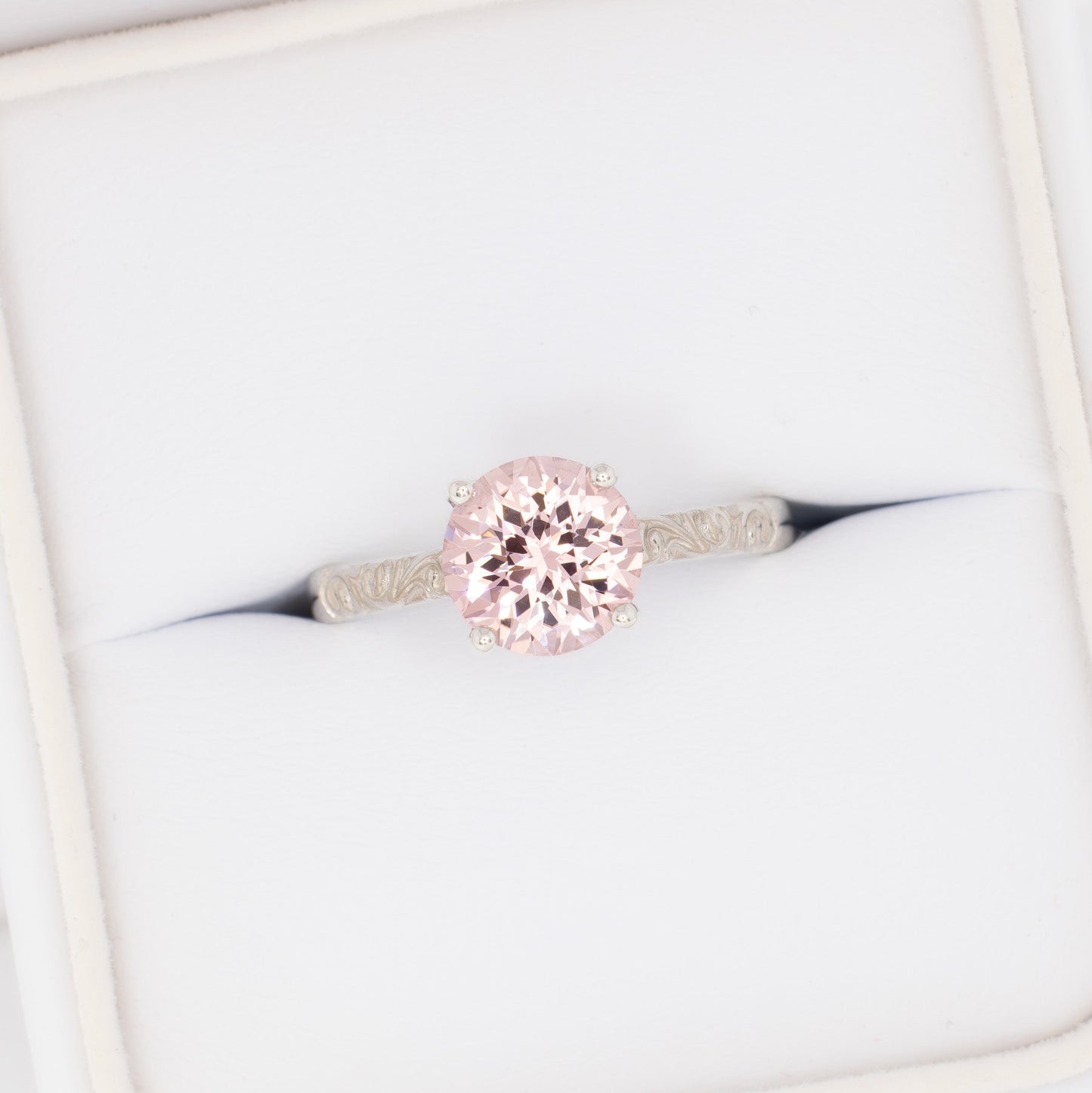 fleur nature inspired solitaire engagement ring with pink lab sapphire round