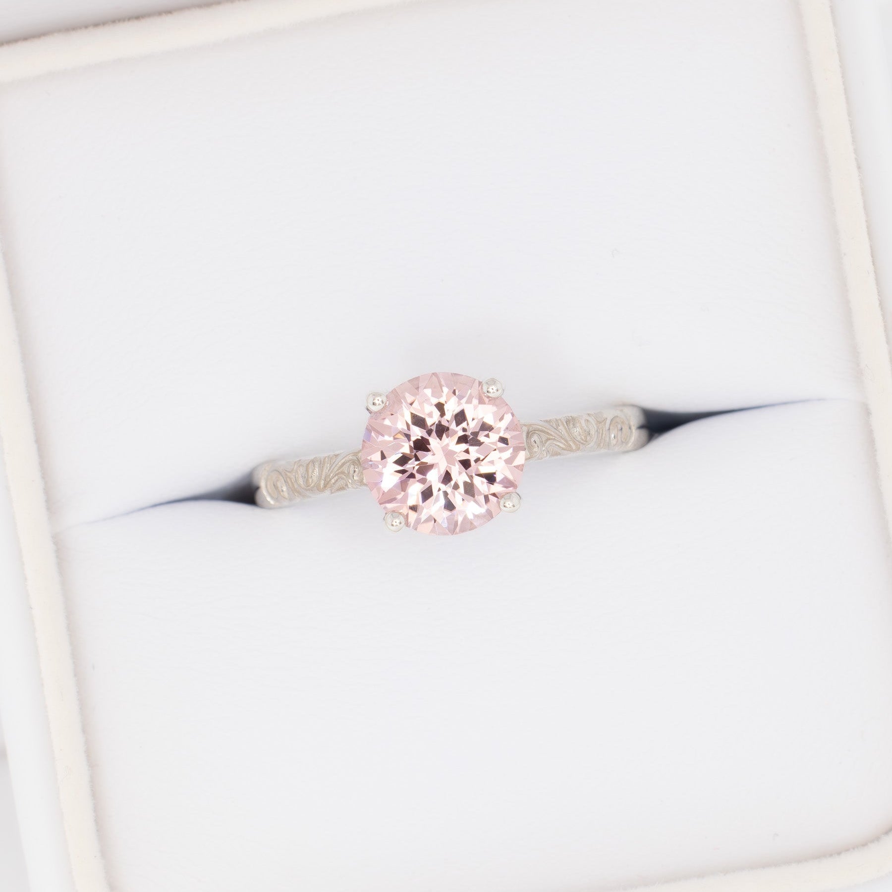 fleur nature inspired solitaire engagement ring with pink lab sapphire round