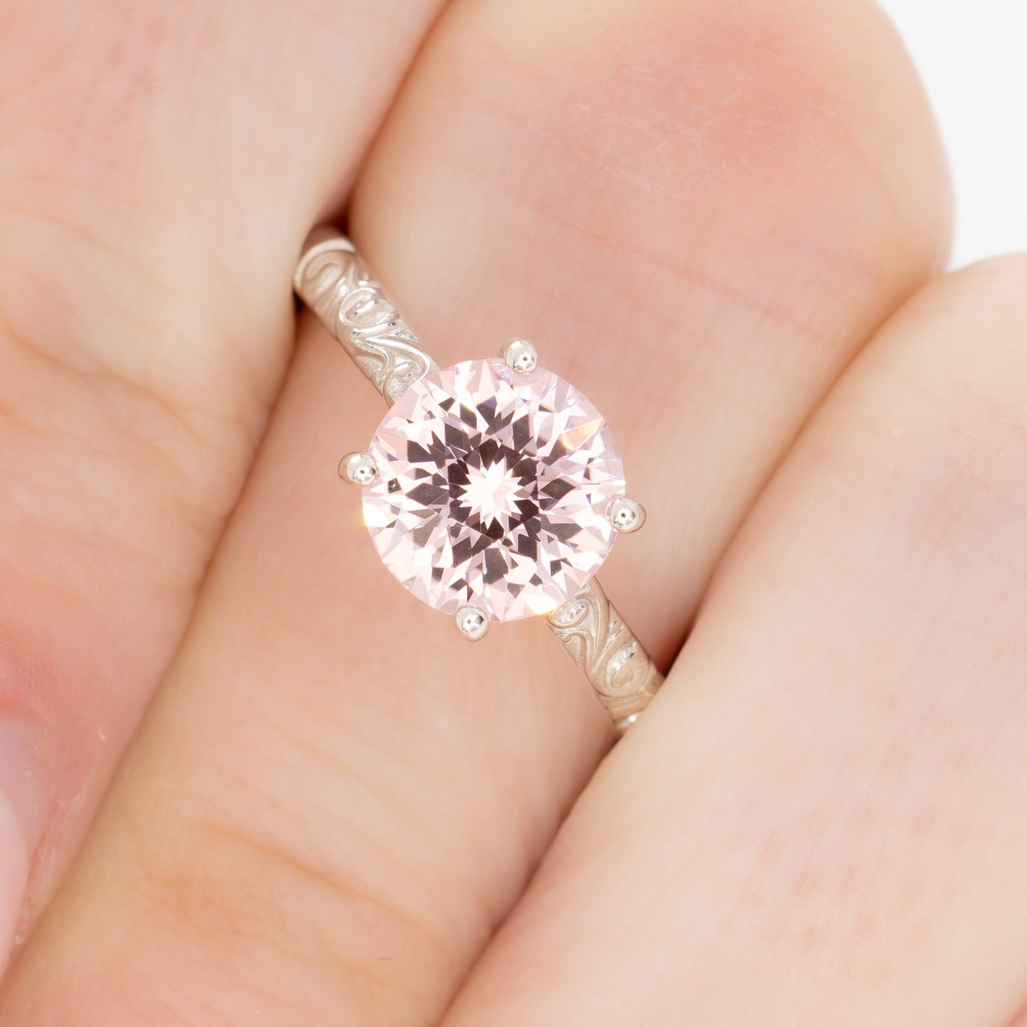 fleur nature inspired solitaire engagement ring with pink lab sapphire round