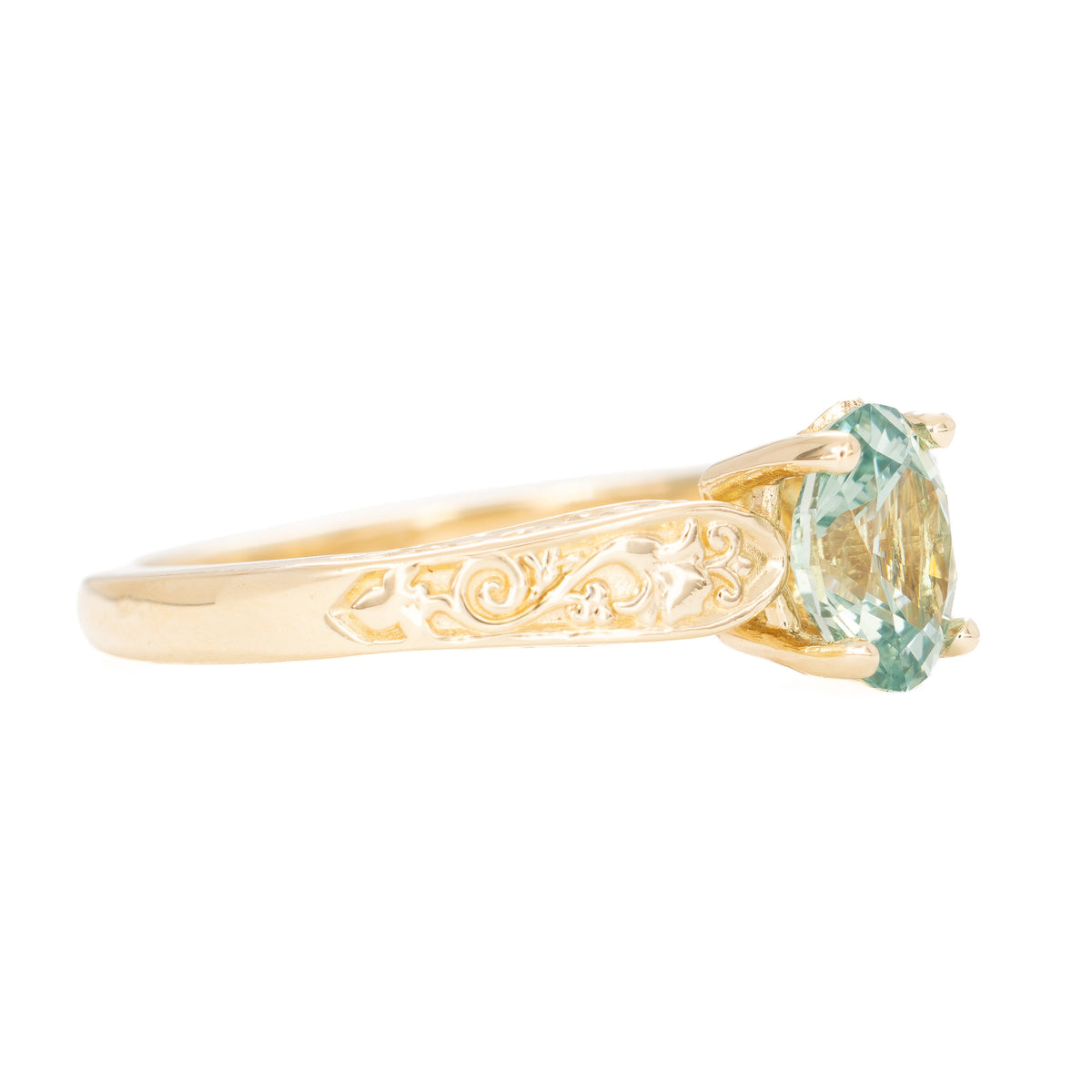 flora nature inspired ring in yellow gold with light green lab sapphire oval
